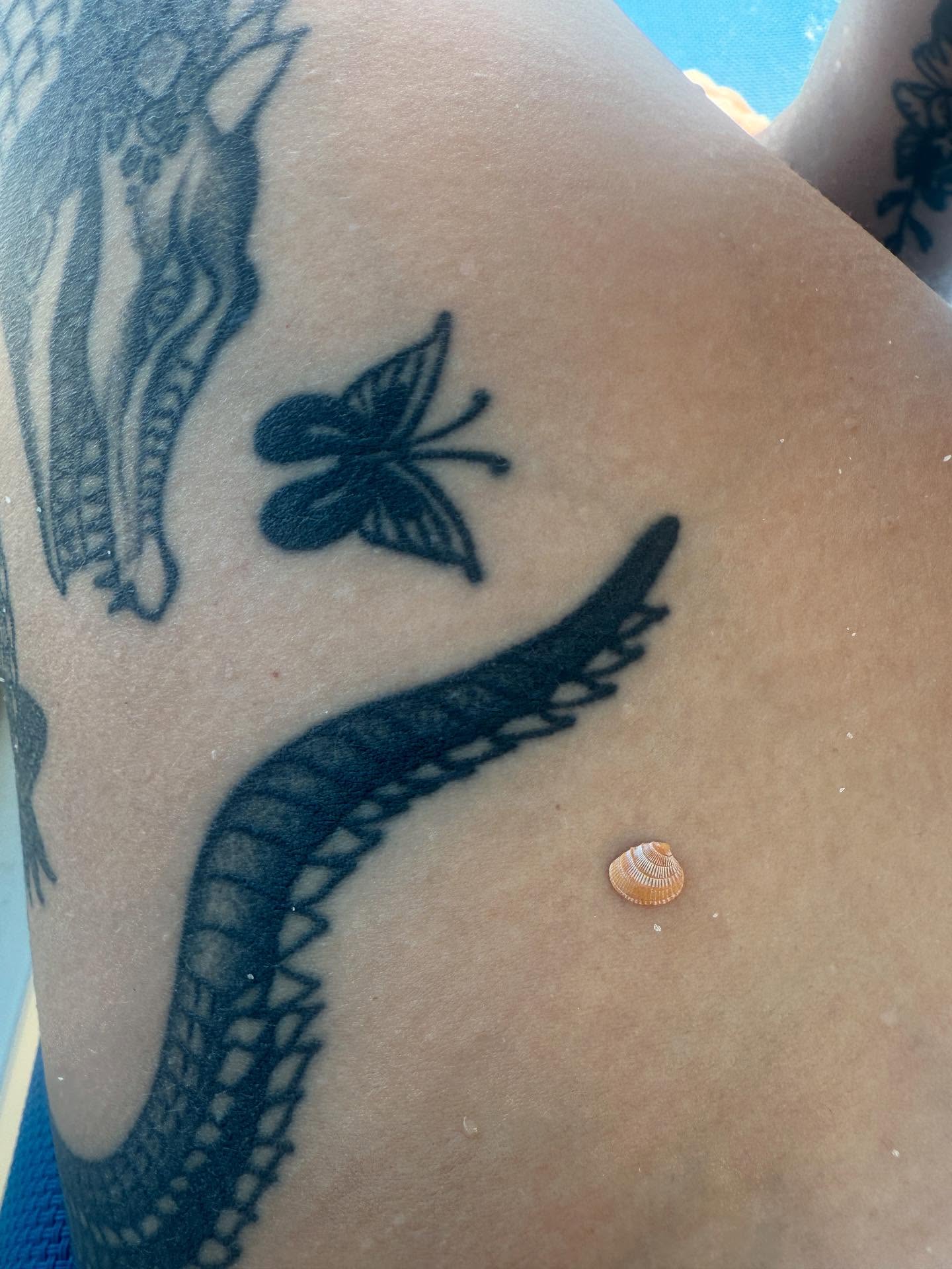 Snake and butterfly black and grey tattoo on the thigh by π½πππππ π½πππππππ, New Orleans, Louisiana