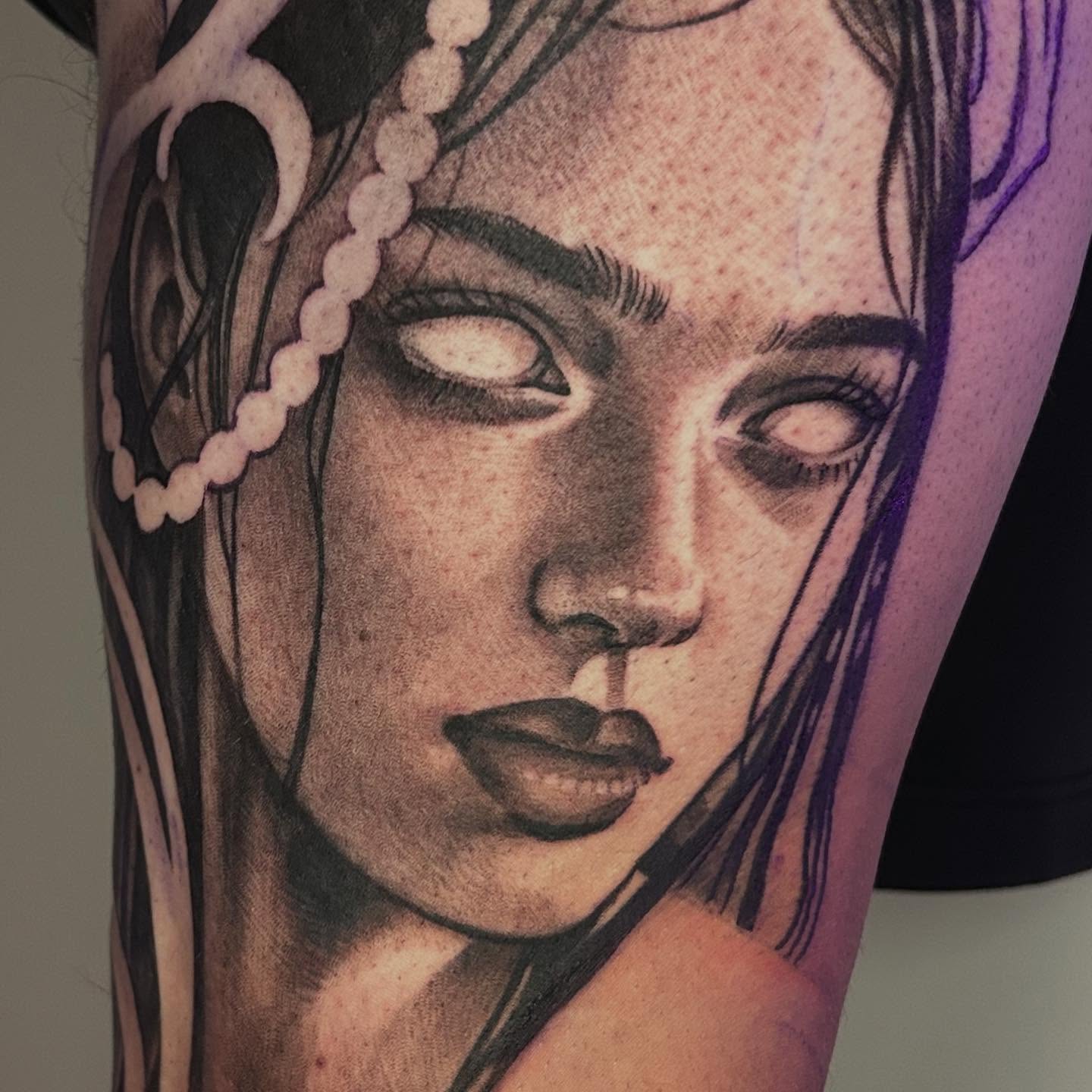Woman's face realism tattoo on the forearm by Whitney Harbin