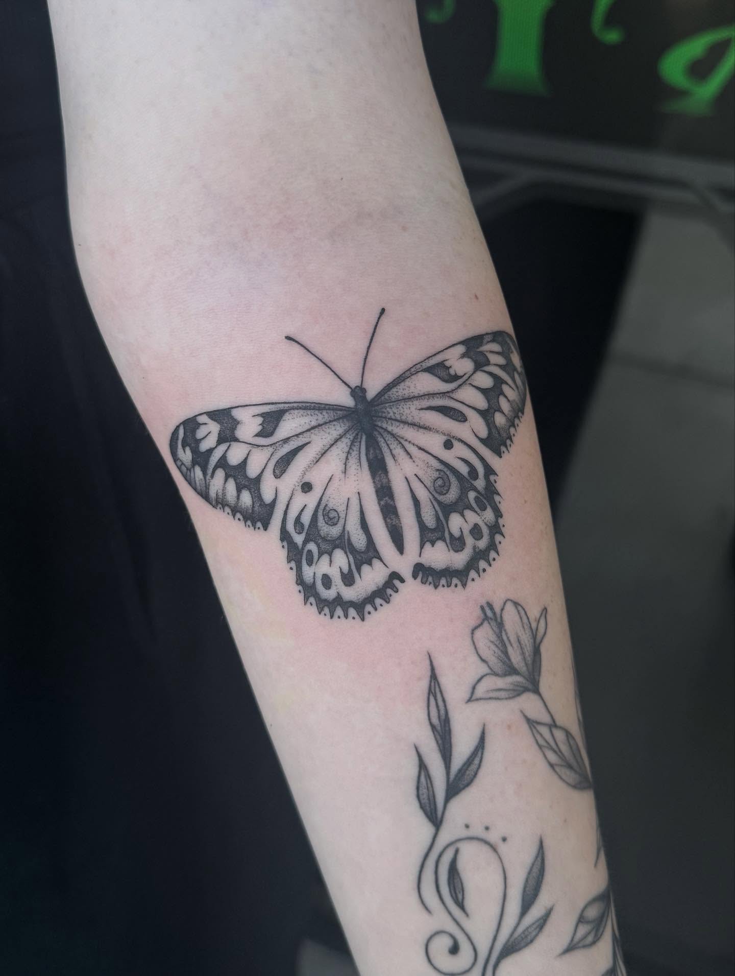 Butterfly black and grey tattoo on the forearm by Jianna