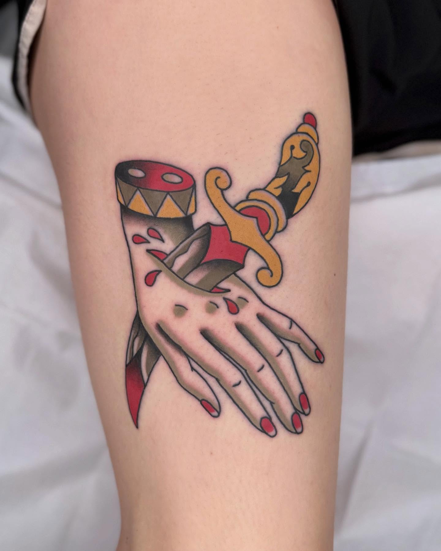 Hand with dagger and drum American traditional tattoo on the forearm by Curtis Stairs, Seattle, Washington