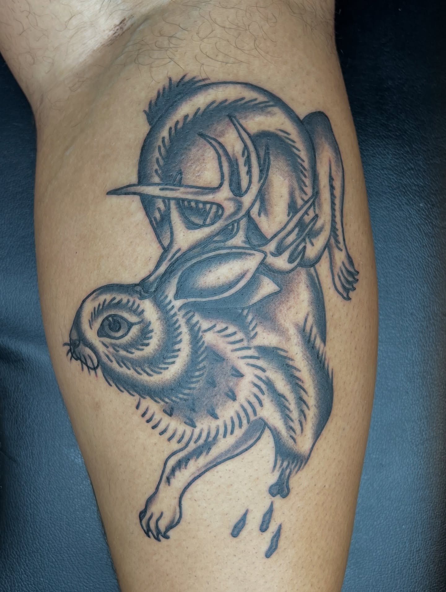 Deer and rabbit black and grey tattoo on the thigh by Cory Miller