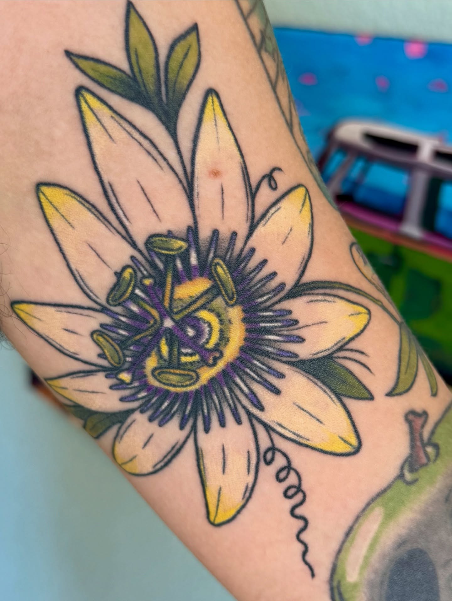 Passion flower American traditional tattoo on the forearm by Sophie McTear