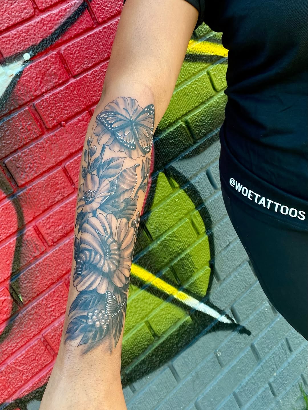 Butterflies and flowers neo-traditional tattoo on the forearm by Israel Jacob Woehler