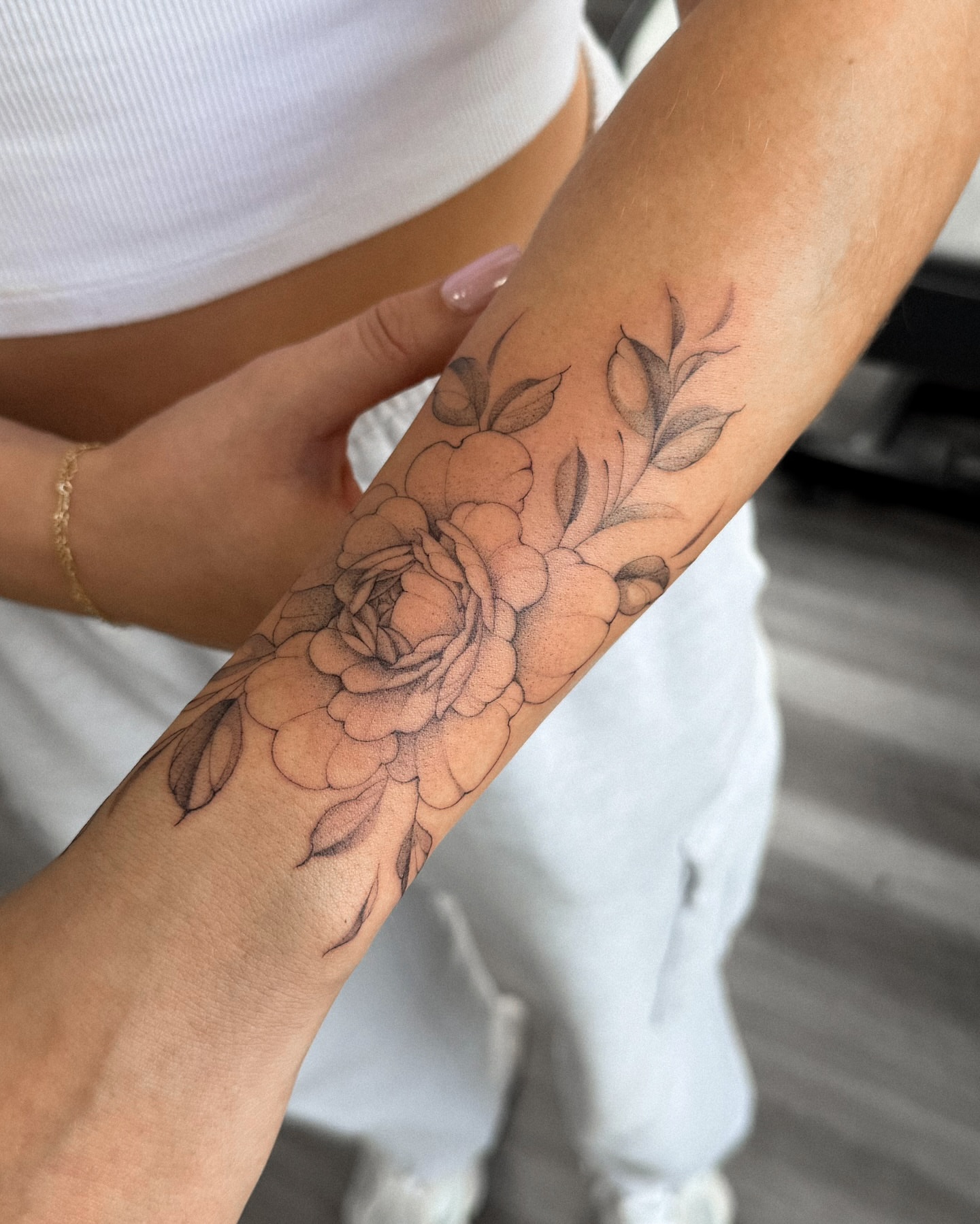 Floral bouquet black and grey tattoo on the forearm by Daniel Montoya, Charlotte, North Carolina