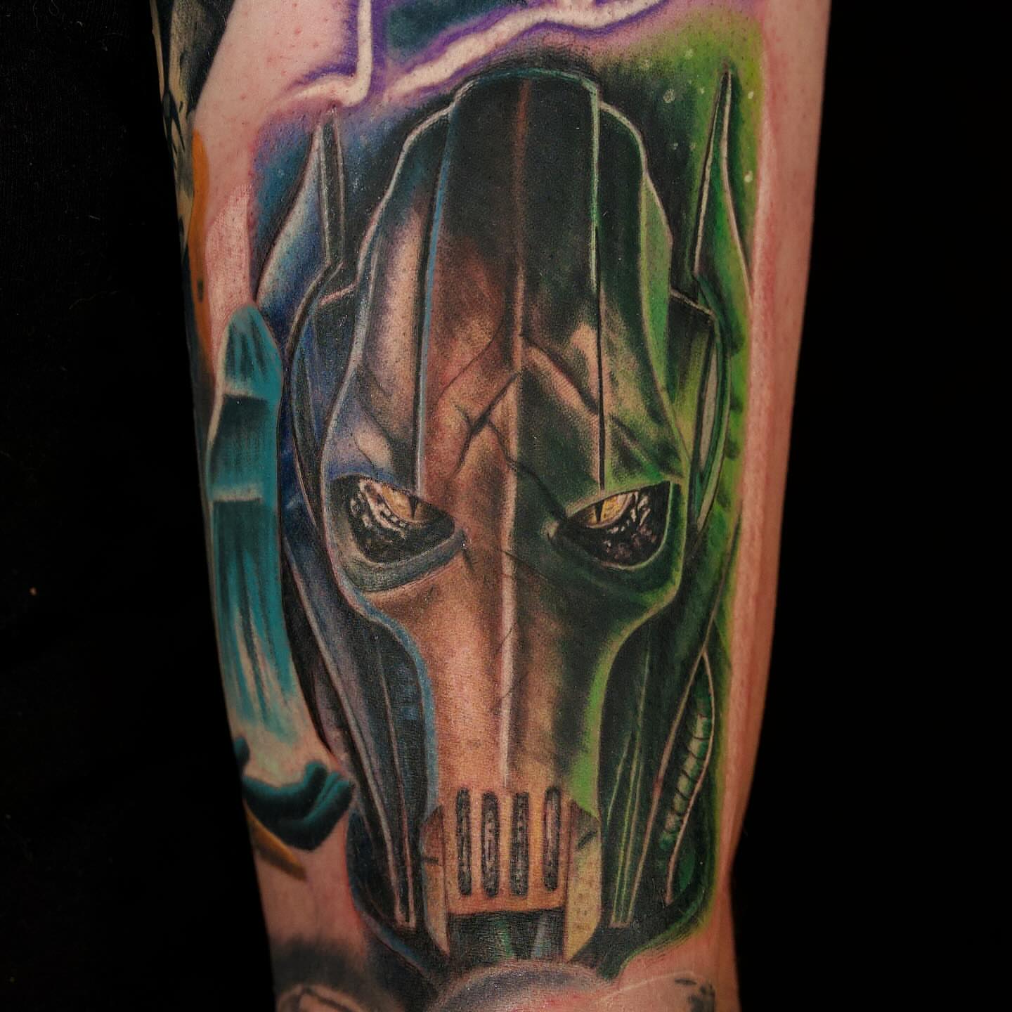 Transformer helmet realism tattoo on the forearm by Chris Lochbihler