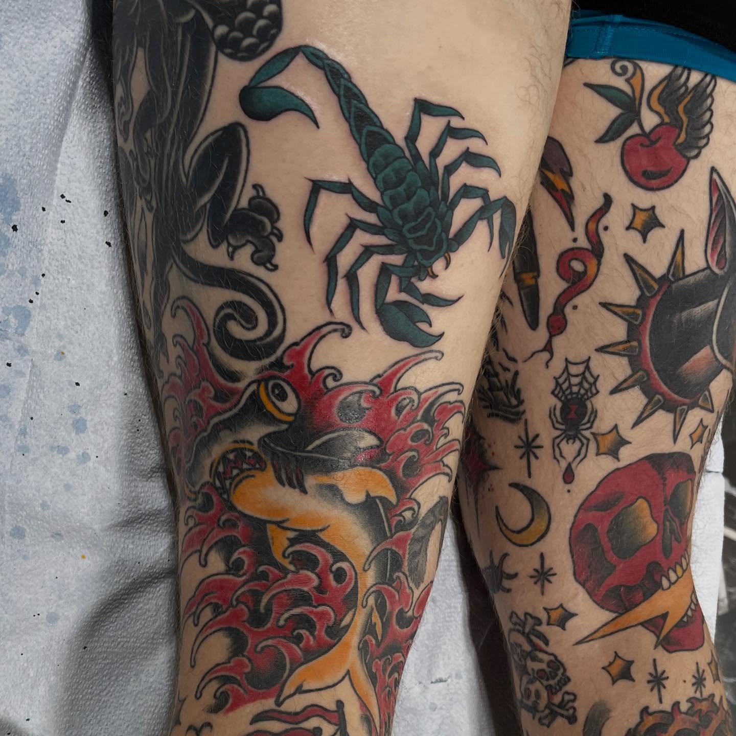 Scorpion and fish American traditional tattoo on the leg by Jaxson Eugene Brady-Hobart