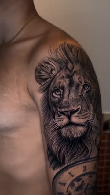Lion and clock realism tattoo by Tiago Britto