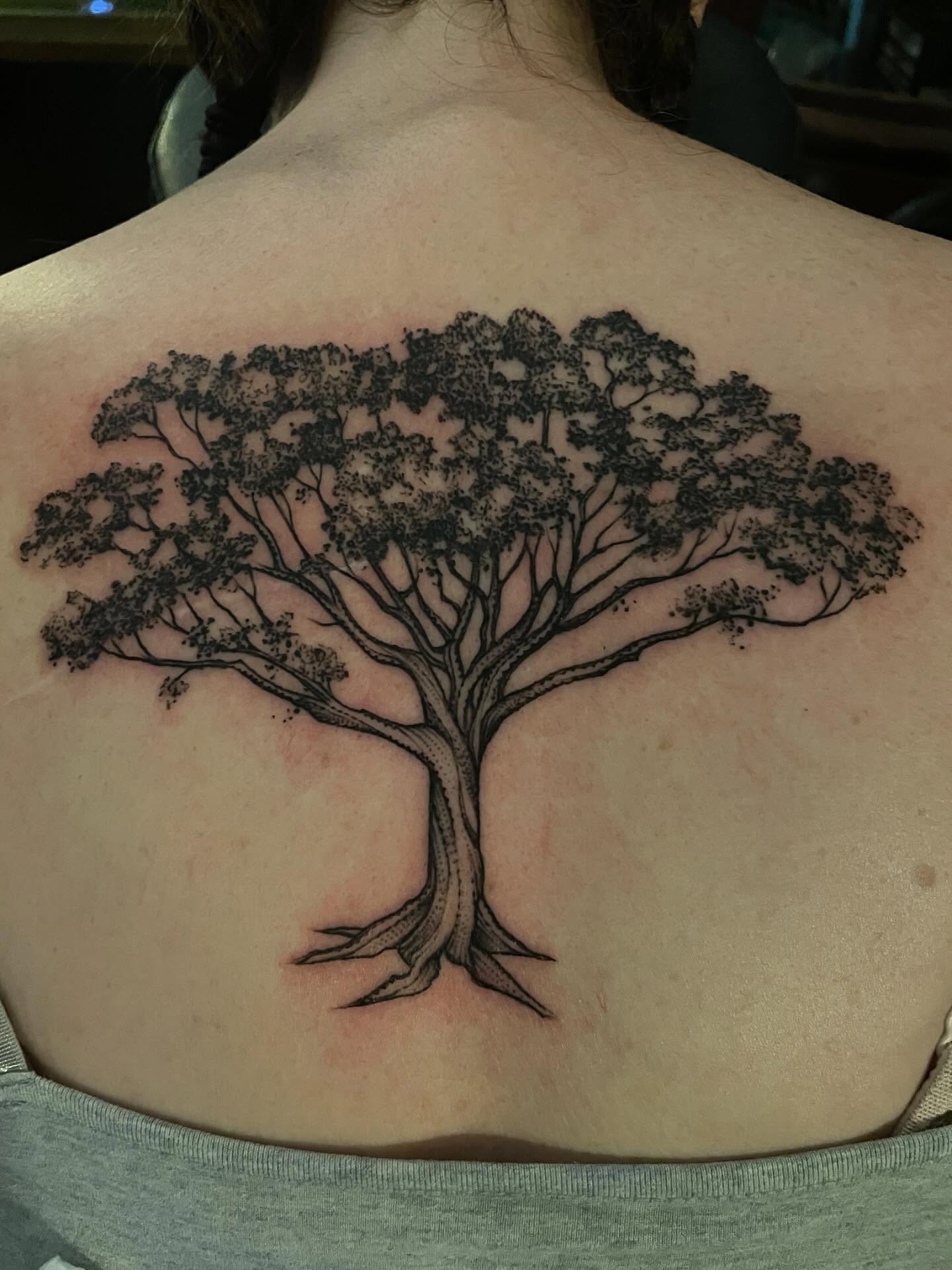 Tree black and grey tattoo on the back by Jacob Kearney