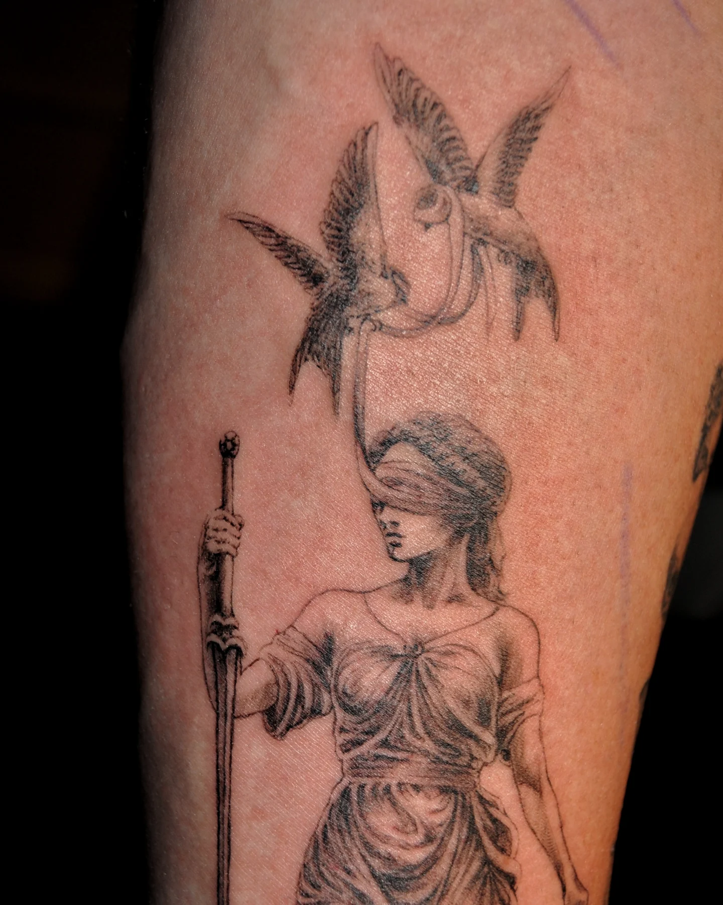 Justice statue realism tattoo on the forearm by Bek Artz