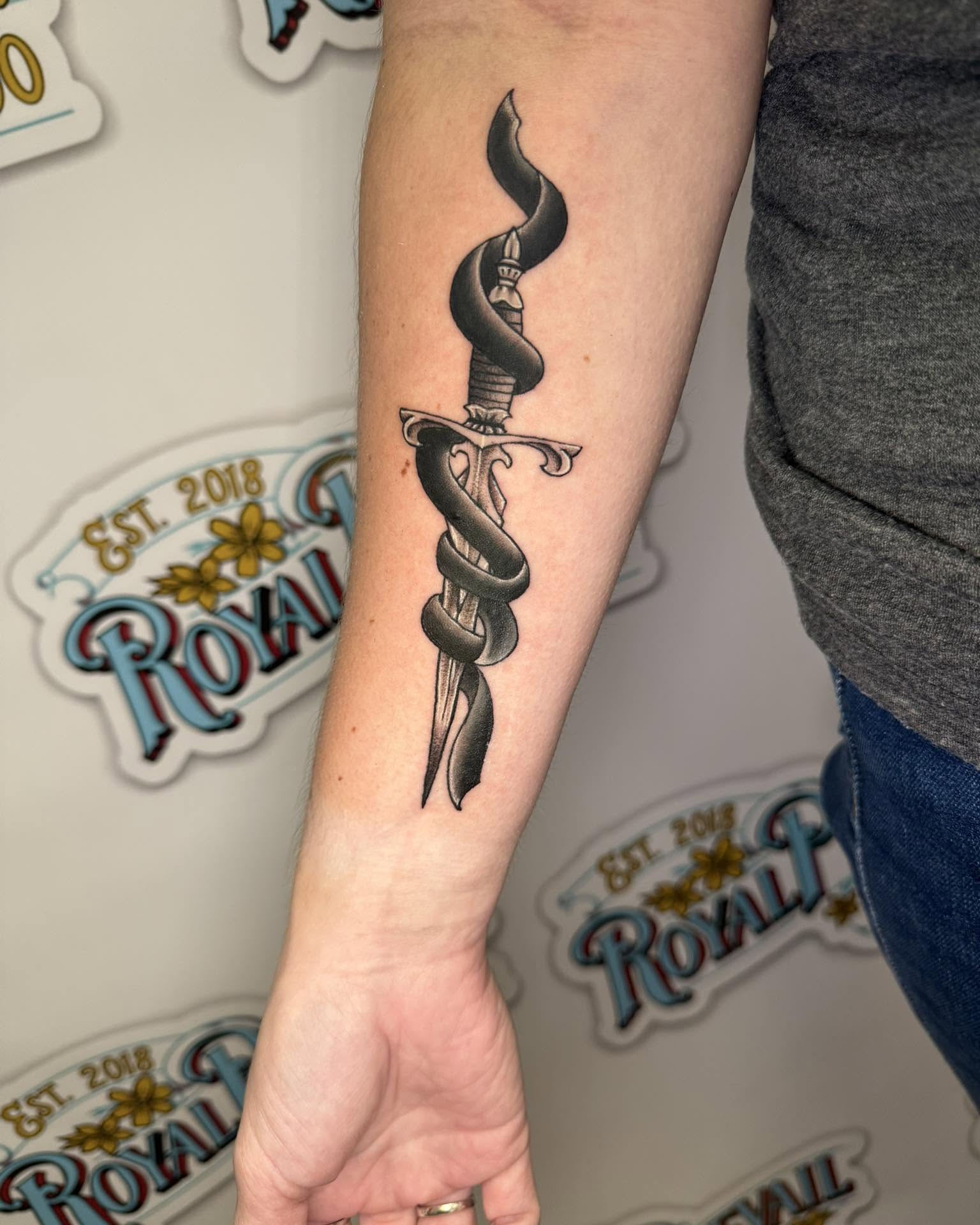 Snake and dagger black and grey tattoo on the forearm by Paul Calhoun Tattoos, Englewood, Ohio