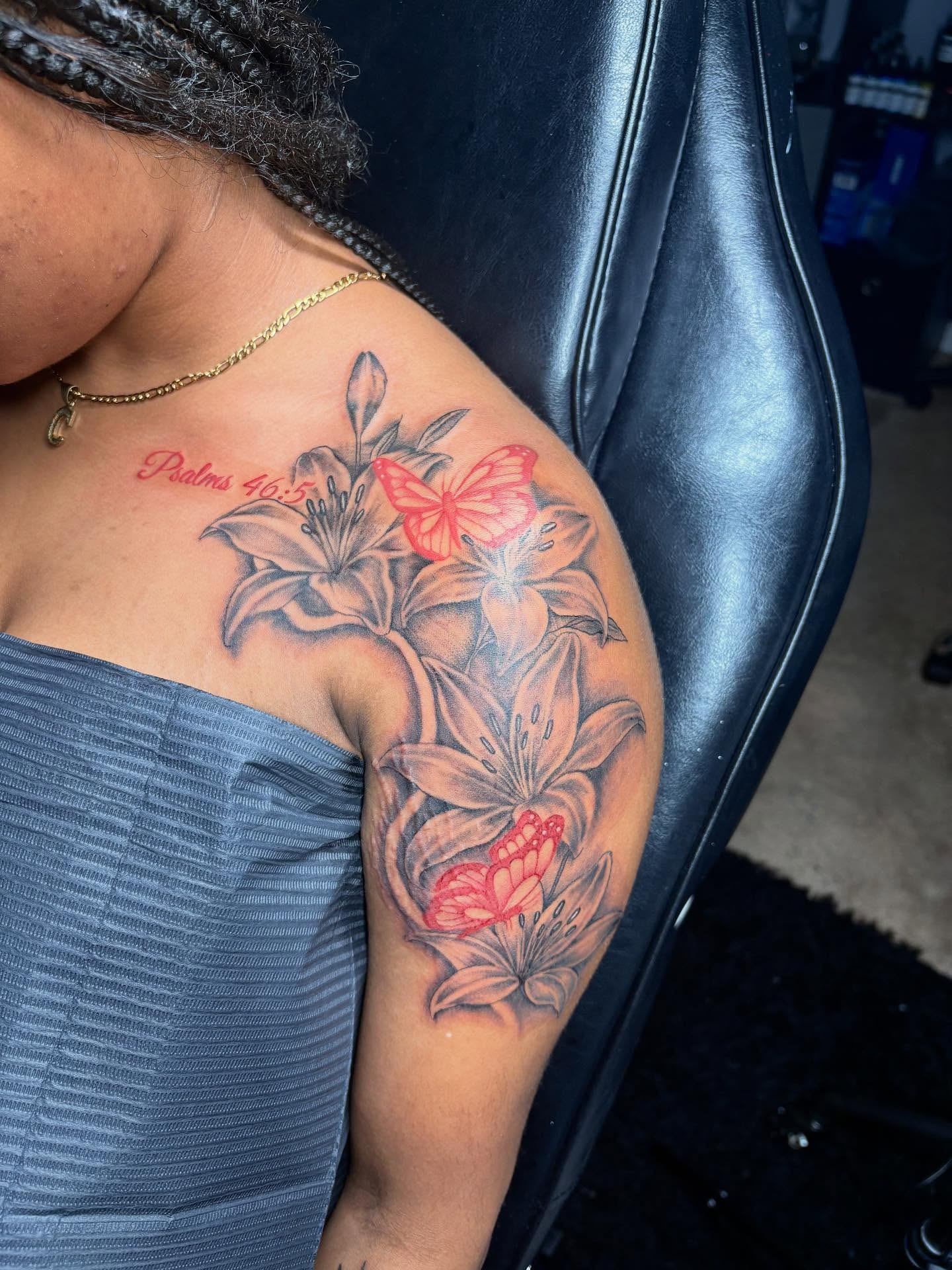 Lilies and butterflies black and grey tattoo on the shoulder by Bay Area Tattoo Artist ✍🏽