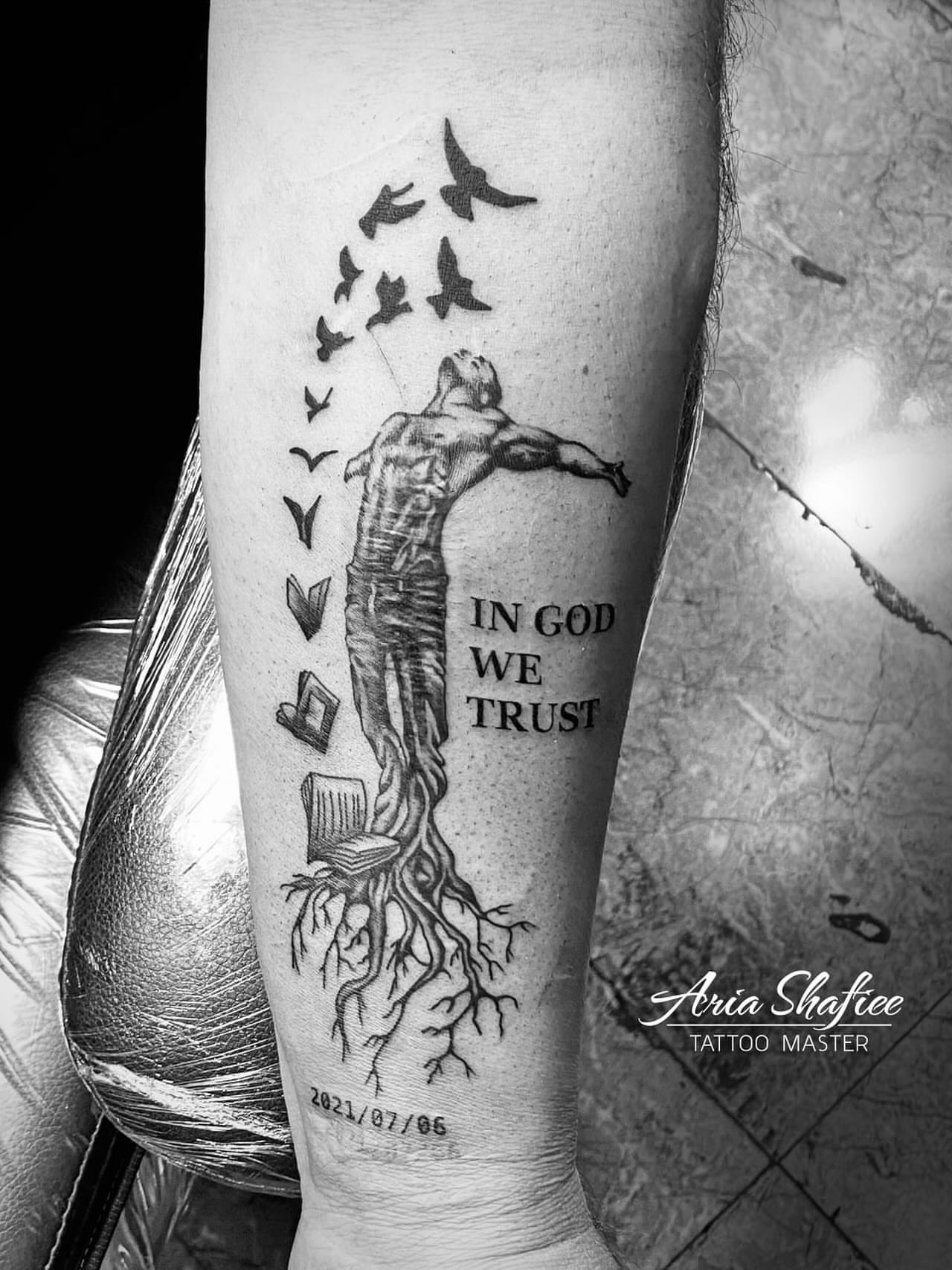 Man flying with birds realism tattoo on the forearm by Aria Shafiee
