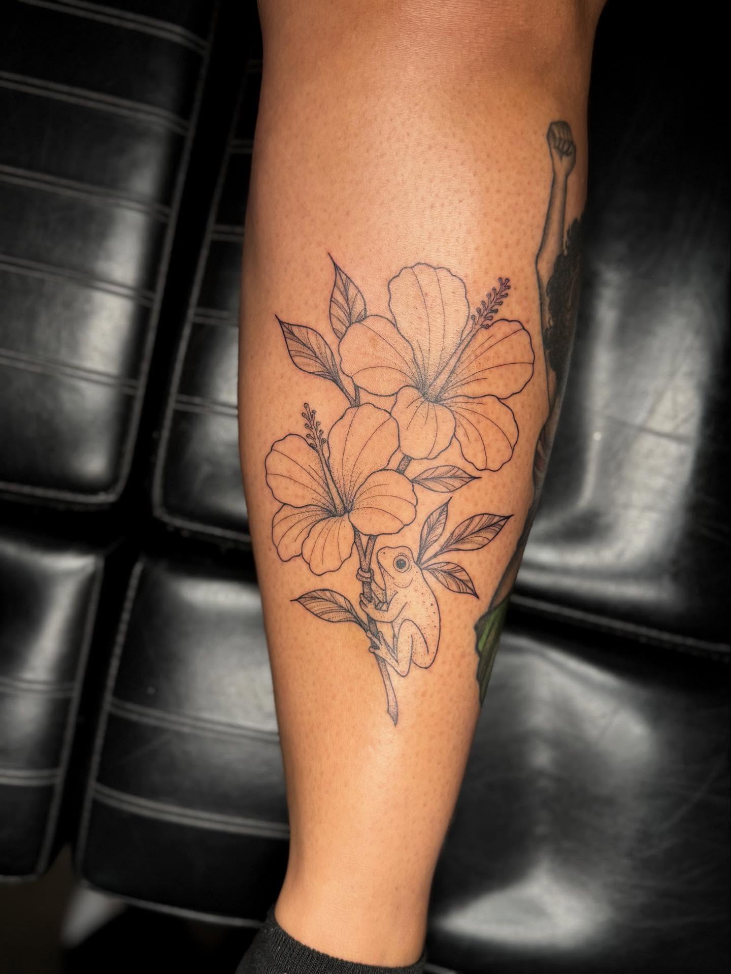 Hibiscus flowers black and grey tattoo on the forearm by Koko