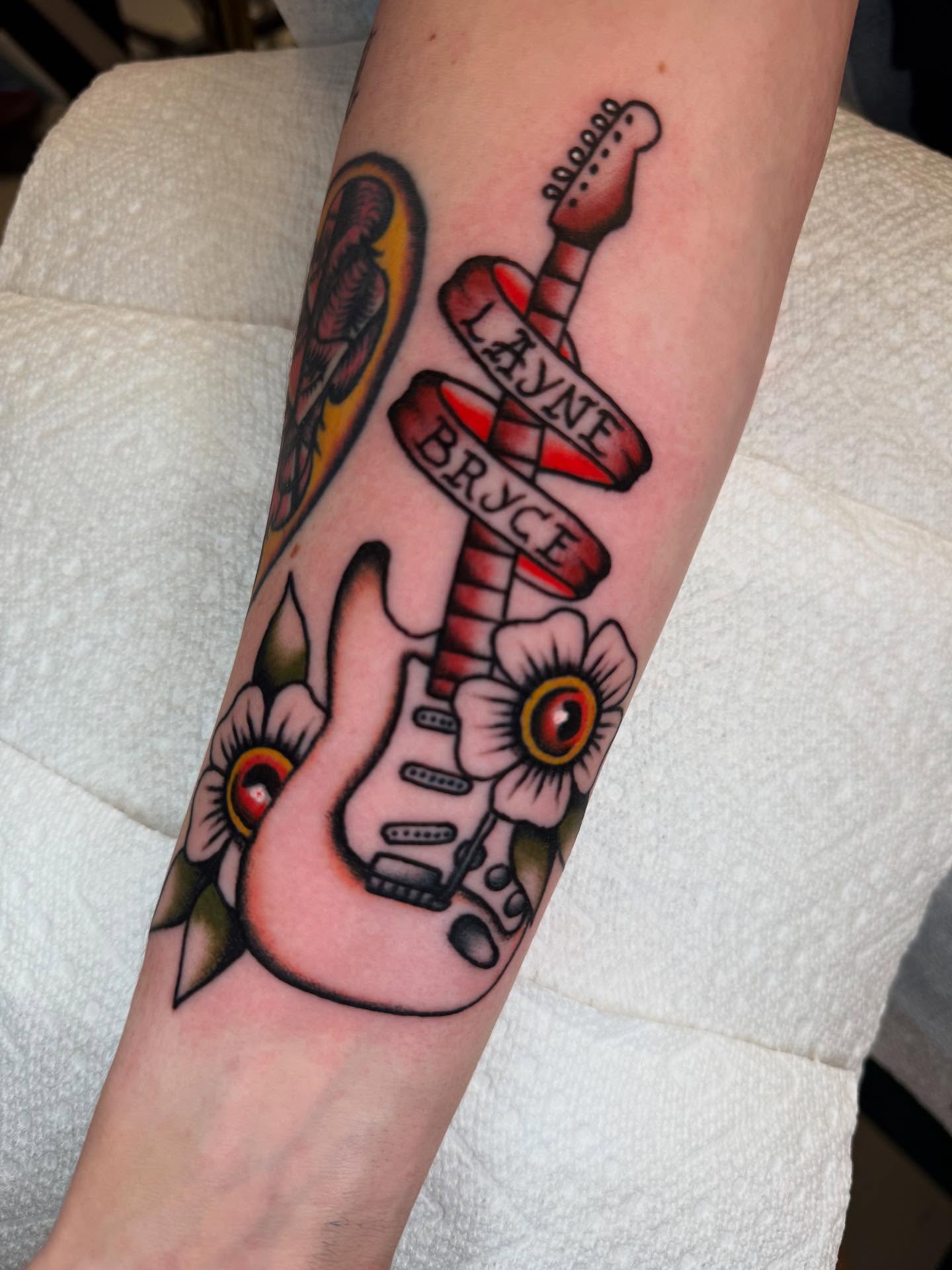 Electric guitar American traditional tattoo on the forearm by Cody Petkus
