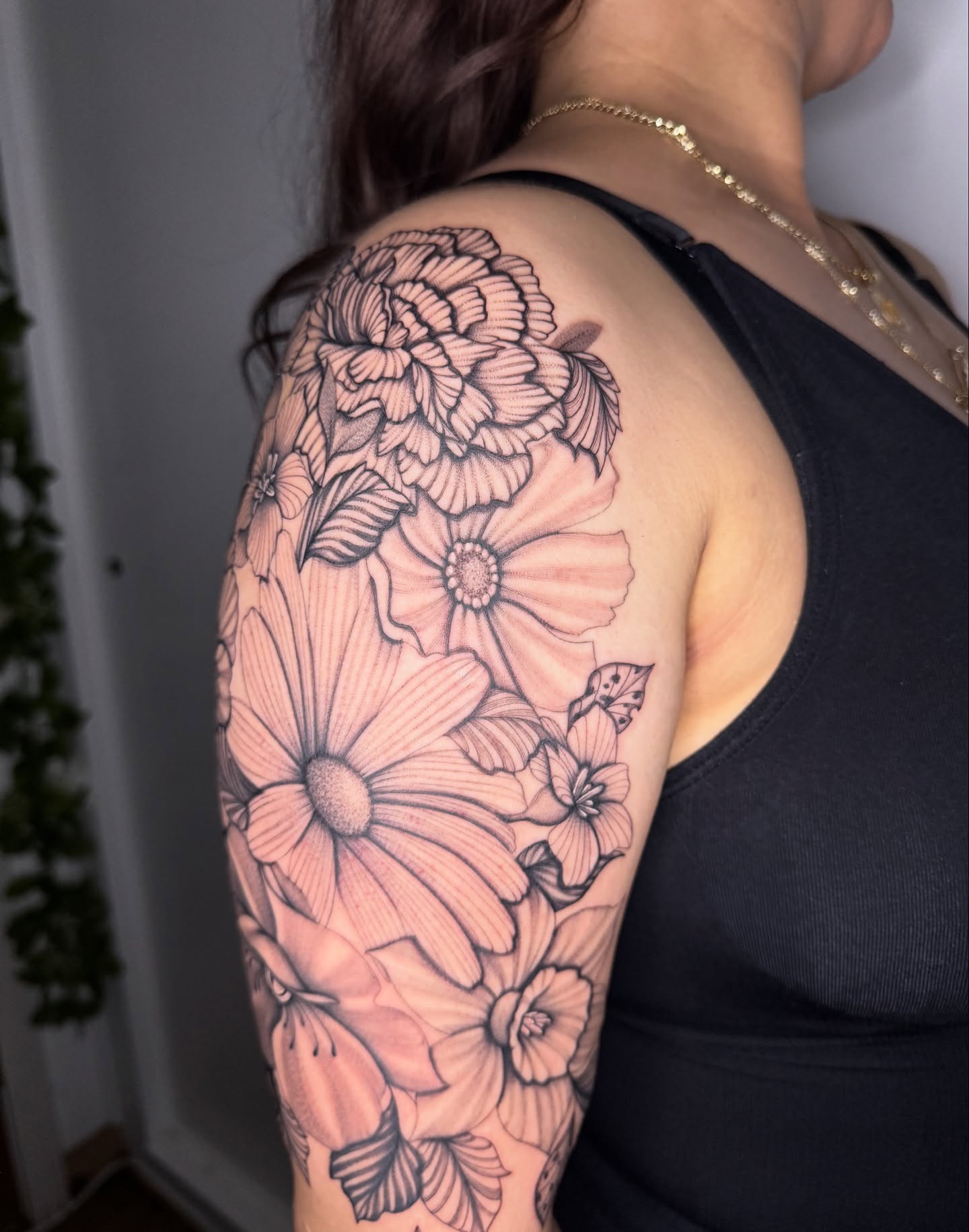 Floral bouquet black and grey tattoo on the shoulder by Austin Tattoo Artist, Austin, Texas