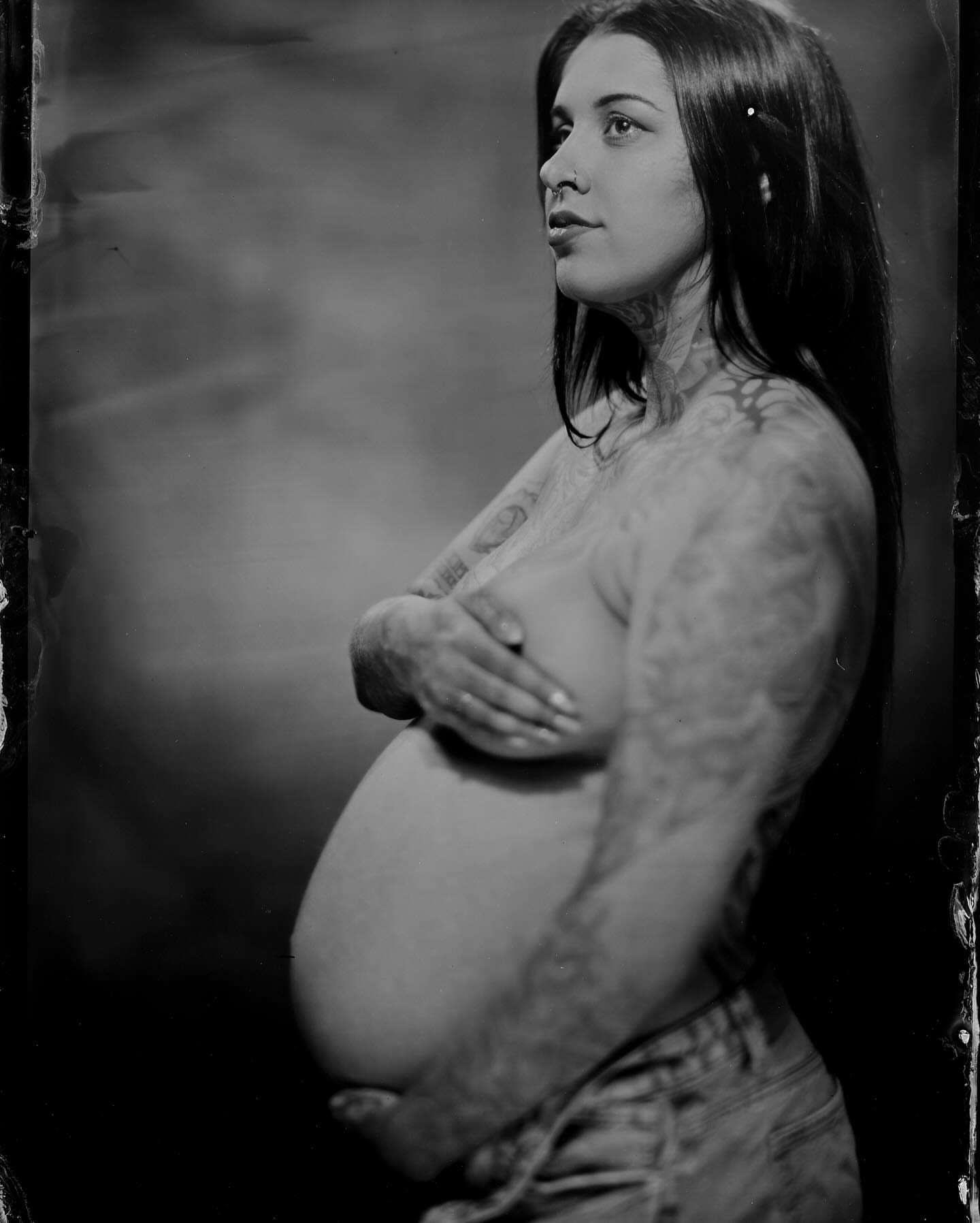 Pregnancy black and grey tattoo on the torso by Zoe D