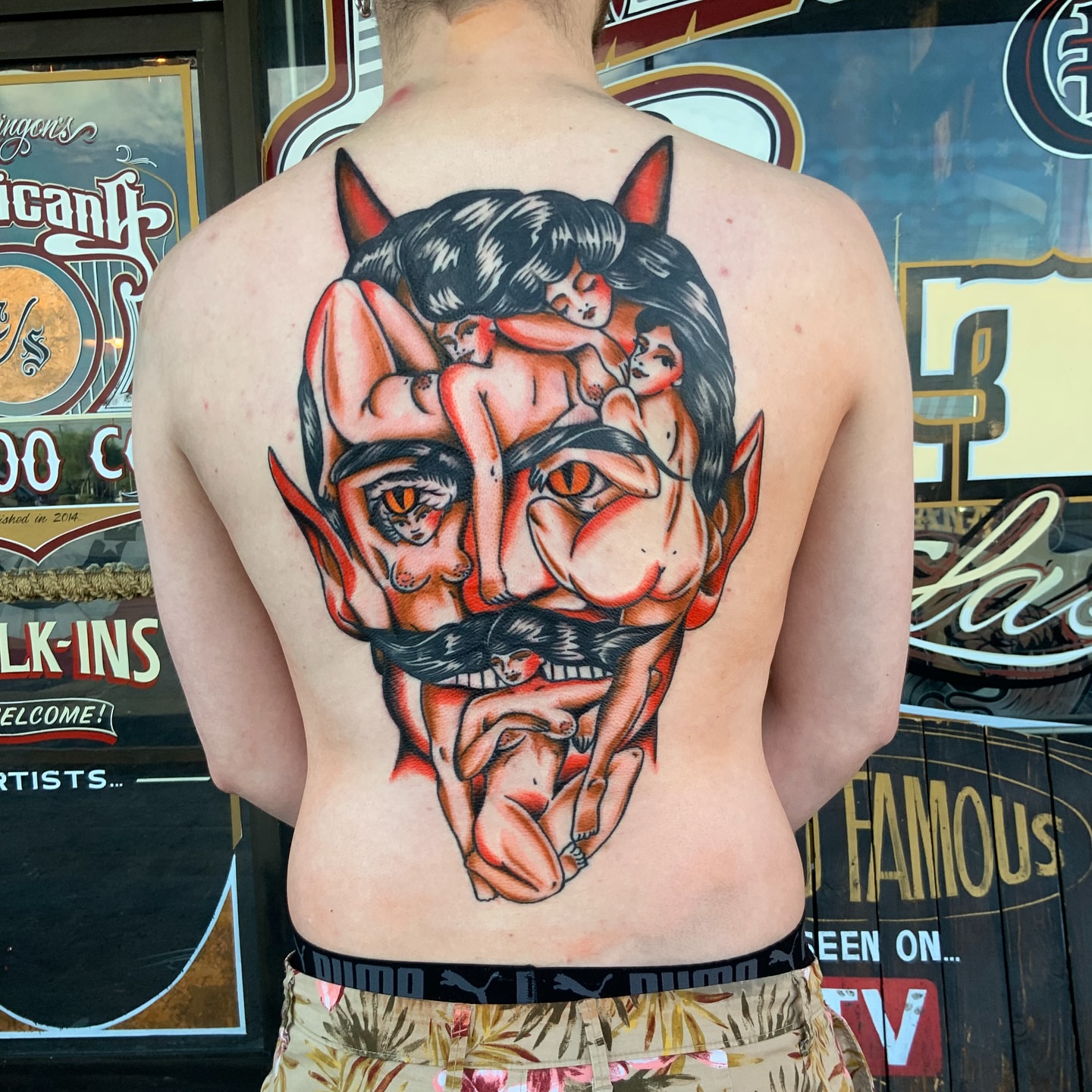 Man with multiple figures American traditional tattoo on the back by Nick Weaver