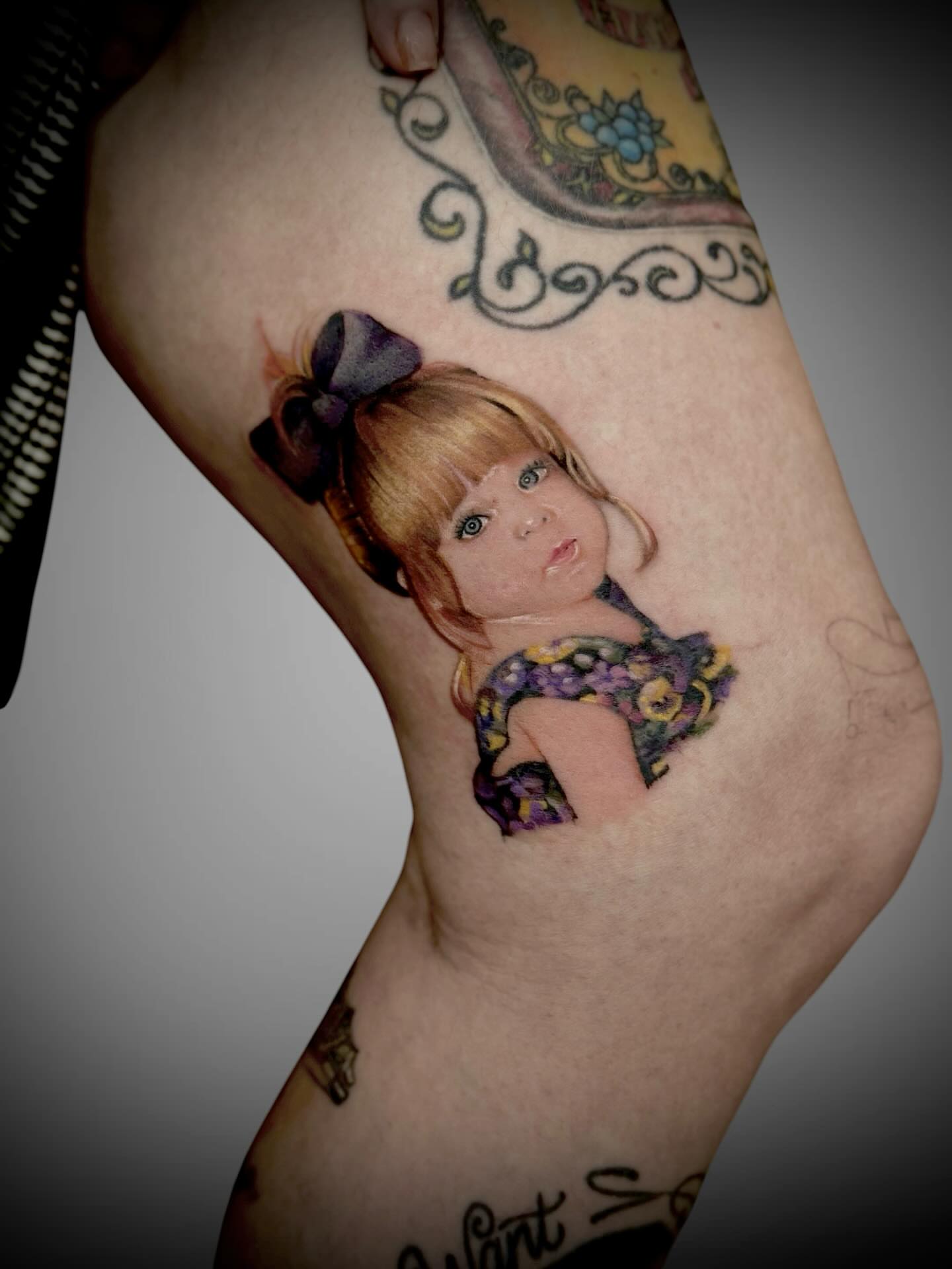 Doll realism tattoo on the forearm by Mitsuko Ching