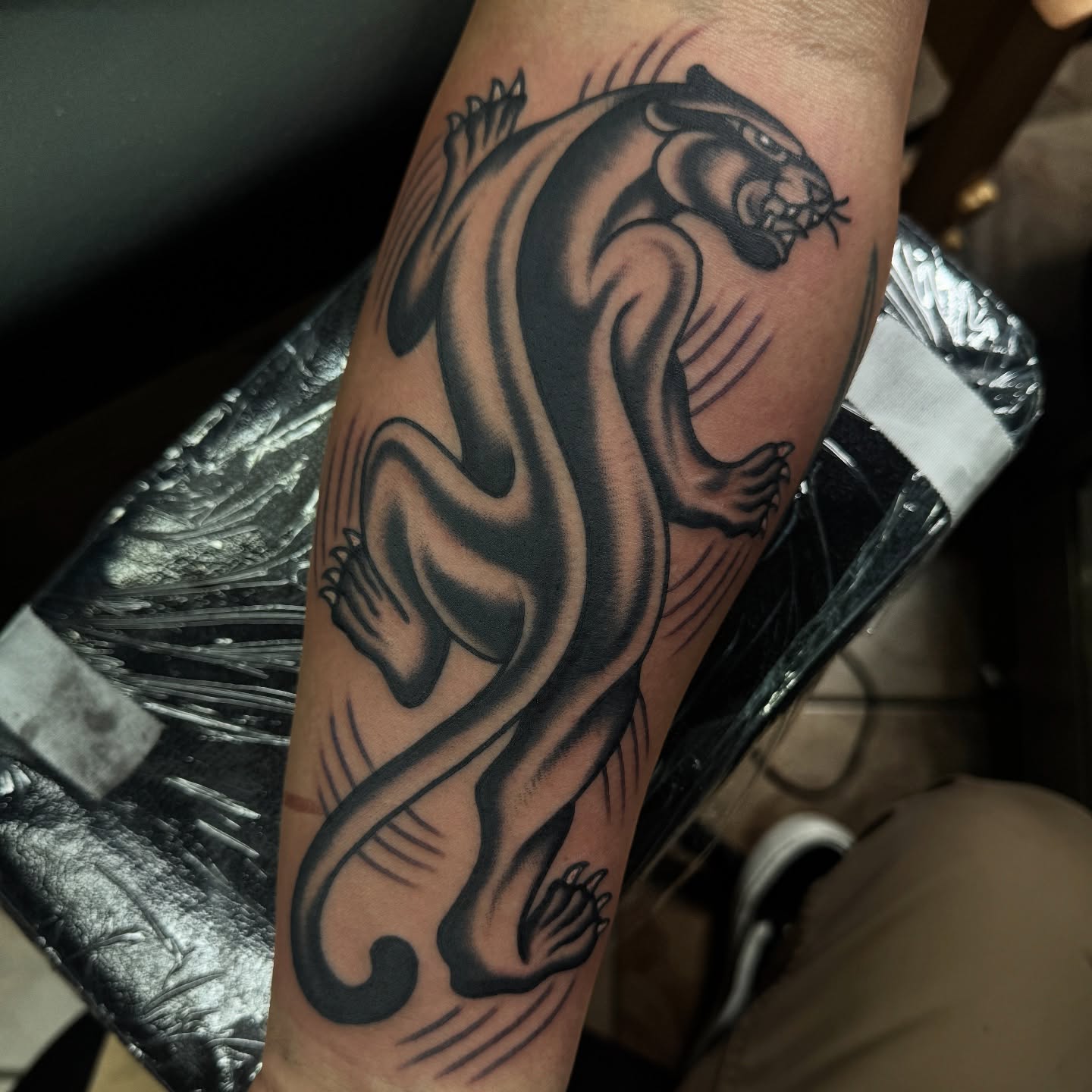 Panther tribal tattoo on the forearm by Daniel Mesen