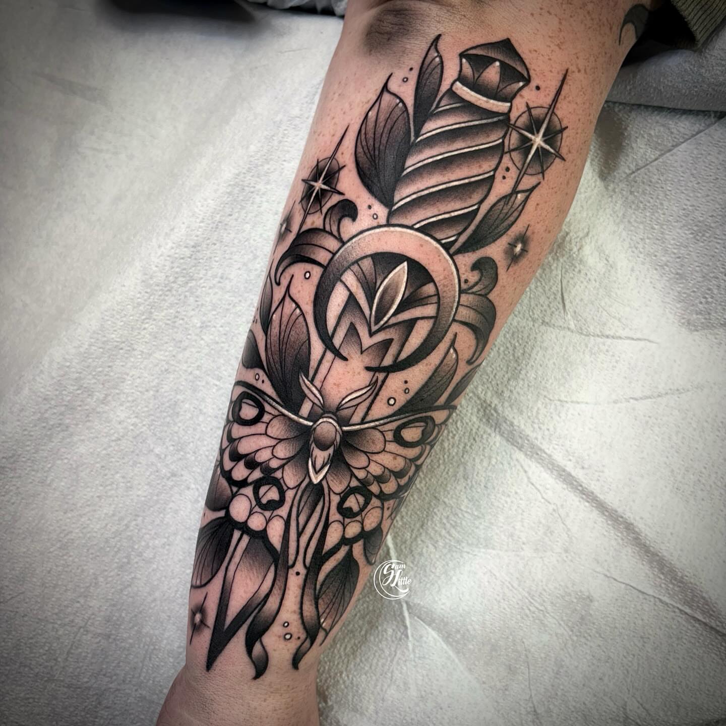 Butterfly and feather geometric tattoo on the forearm by 𝓢𝓪𝓶 𝓛𝓲𝓽𝓽𝓵𝓮