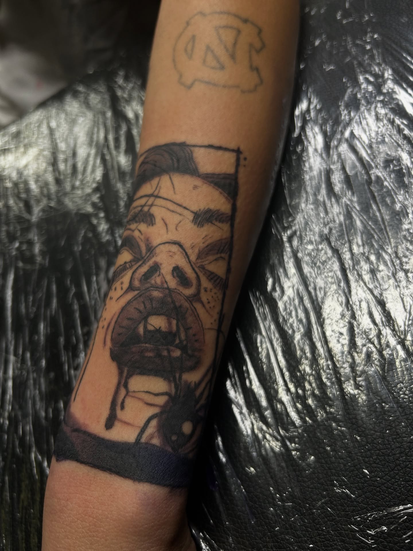 Angry face black and grey tattoo on the forearm by ๐AK