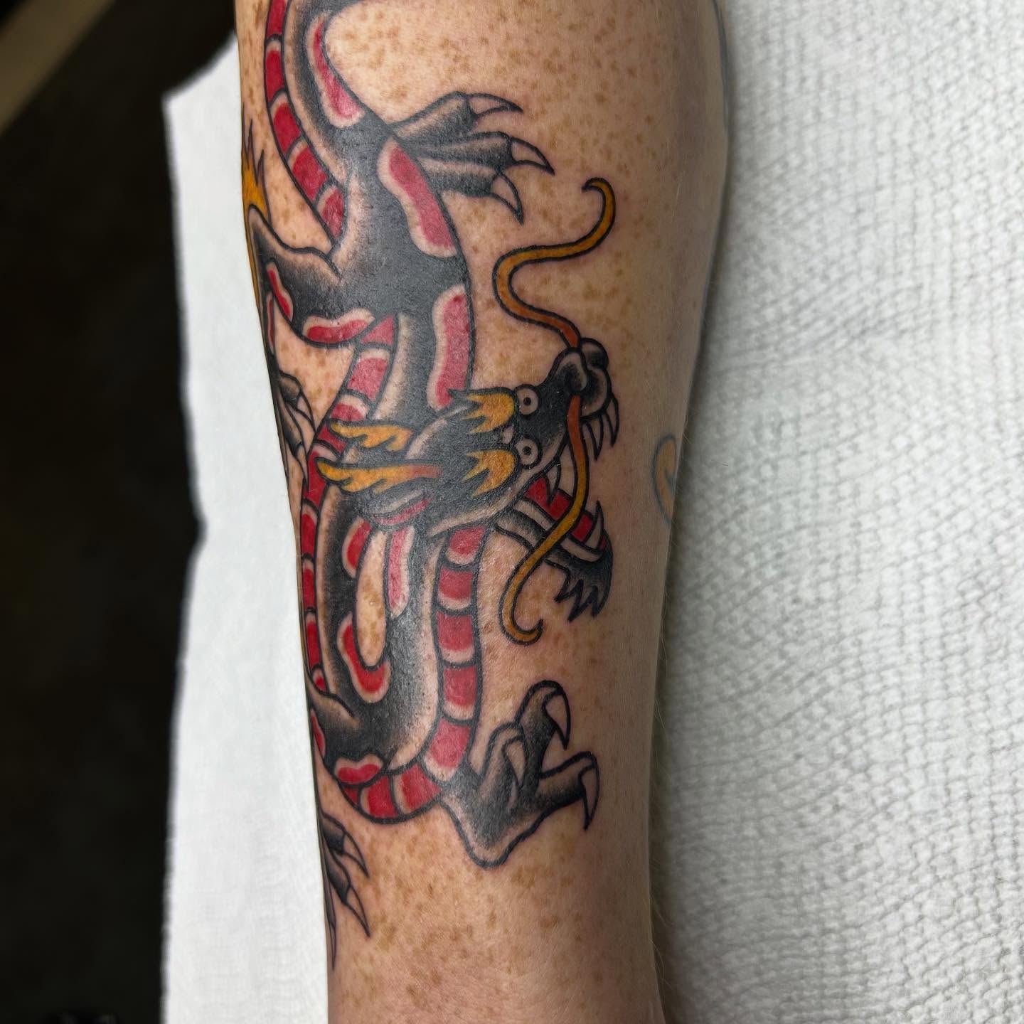 Dragon American traditional tattoo on the forearm by Bregan ✨