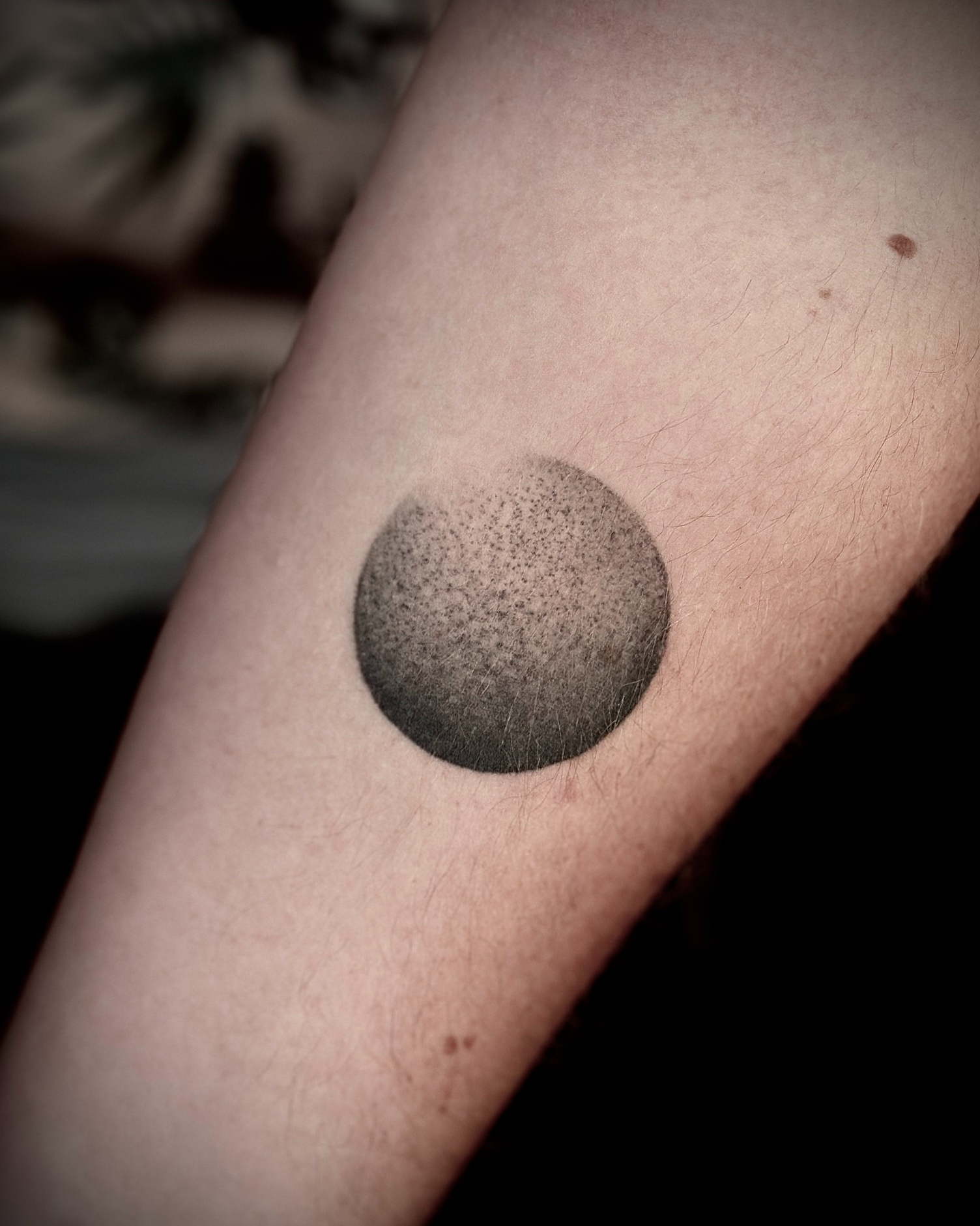 Circle dotwork tattoo on the forearm by Giovanna Kline