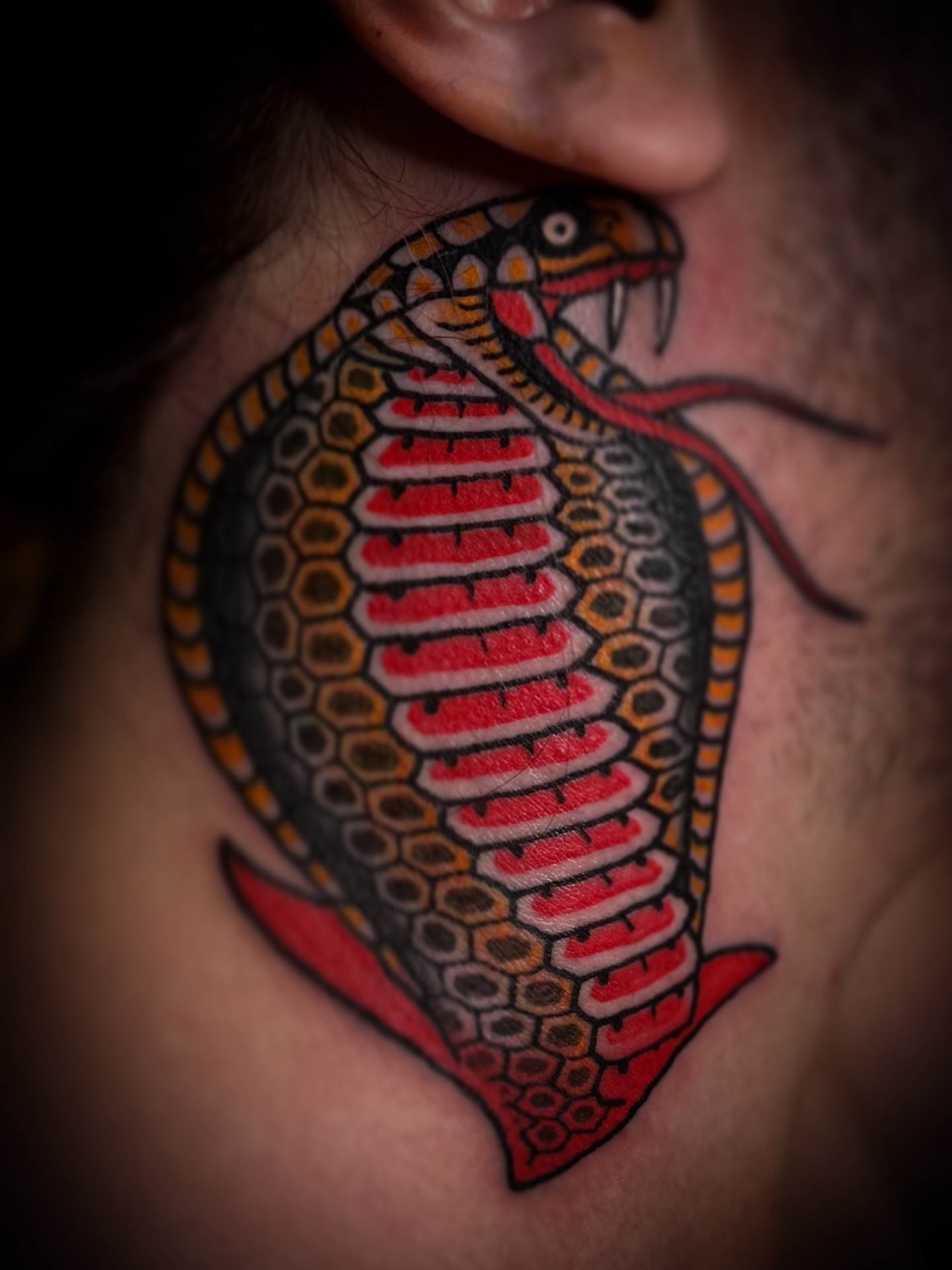 Snake American traditional tattoo on the neck by Drew McElveney, Austin, Texas