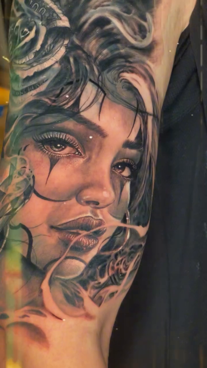 Woman with skull and roses realism tattoo by Brian Ulibarri