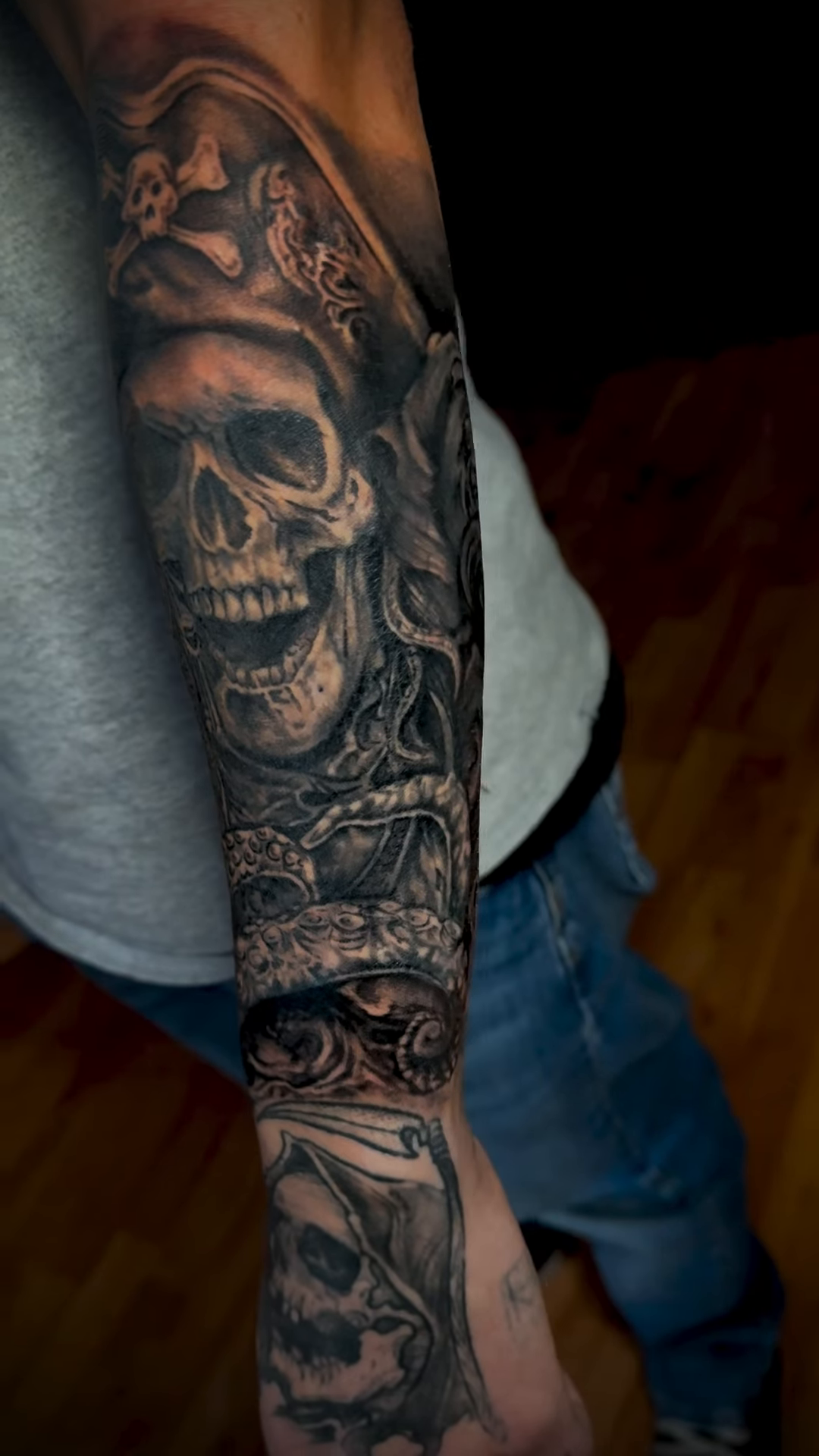 Pirate skull with crown and eye realism tattoo on the forearm by Aaron Ysidro