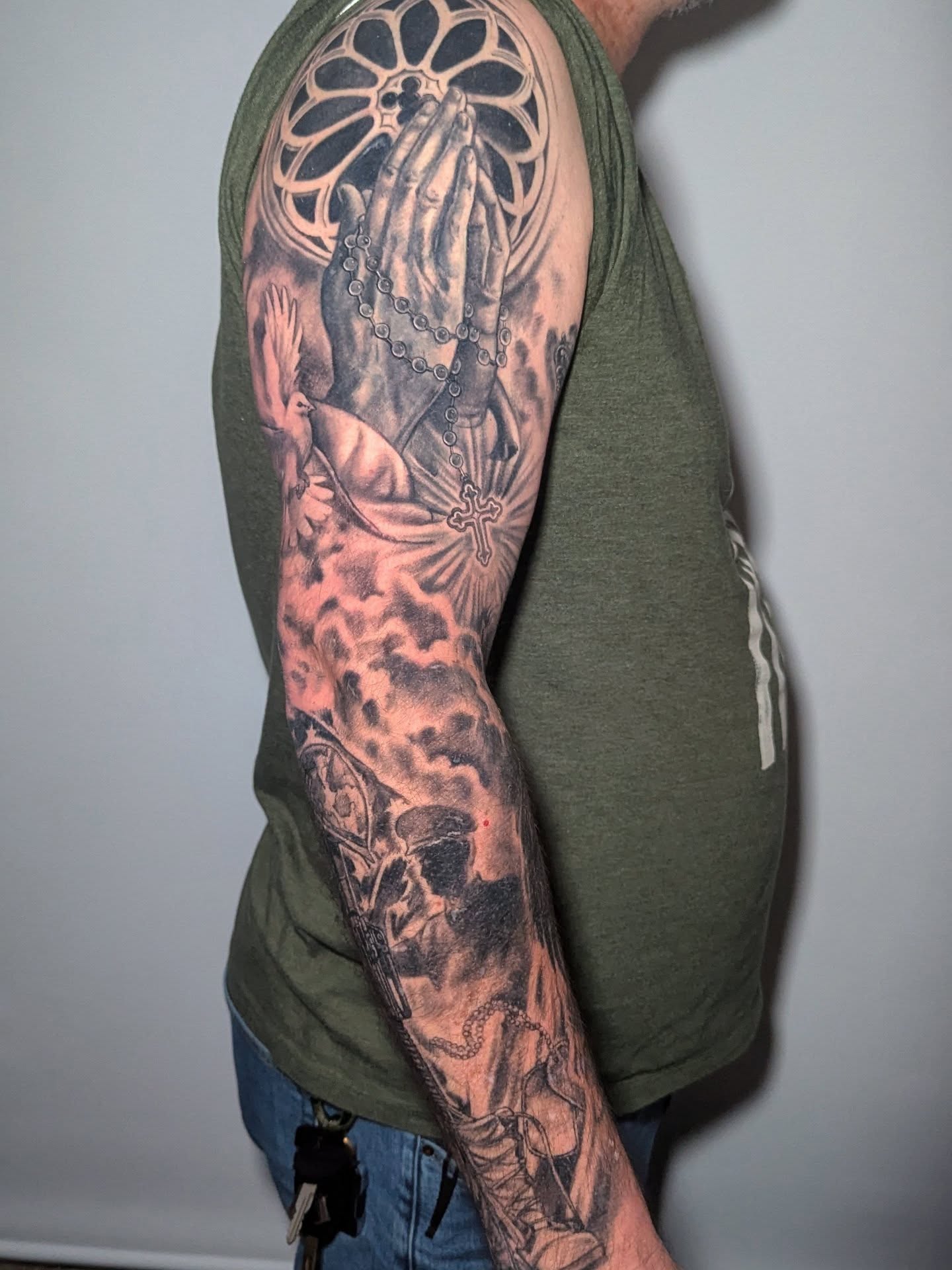 Praying hands with rosary realism tattoo on the upper arm by 💎 Neon