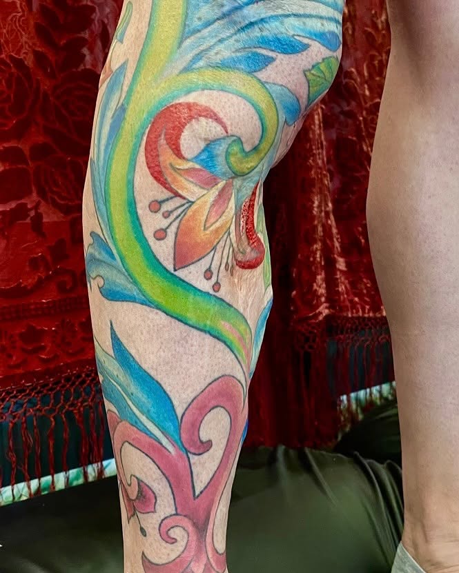 Abstract swirls watercolor tattoo on the forearm by Vyvyn Lazonga