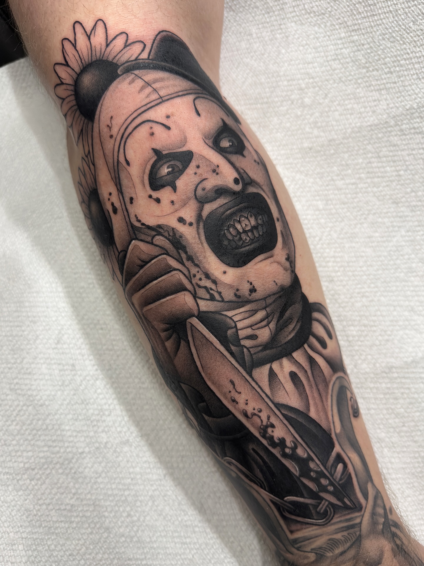 Clown realism tattoo on the forearm by Amy Jean, Minneapolis, Minnesota