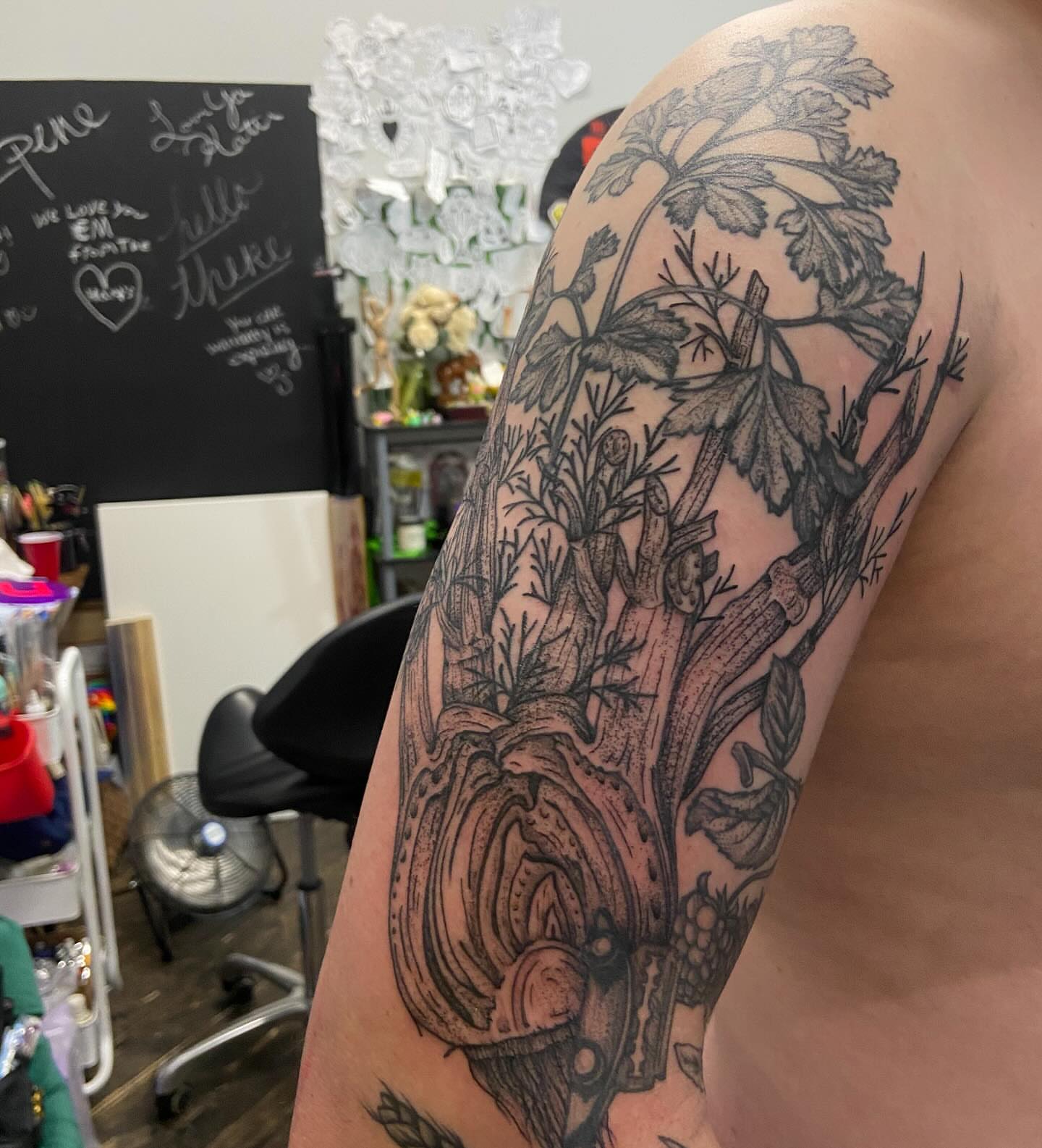 Tree and foliage black and grey tattoo on the upper arm by Dont Worry About It
