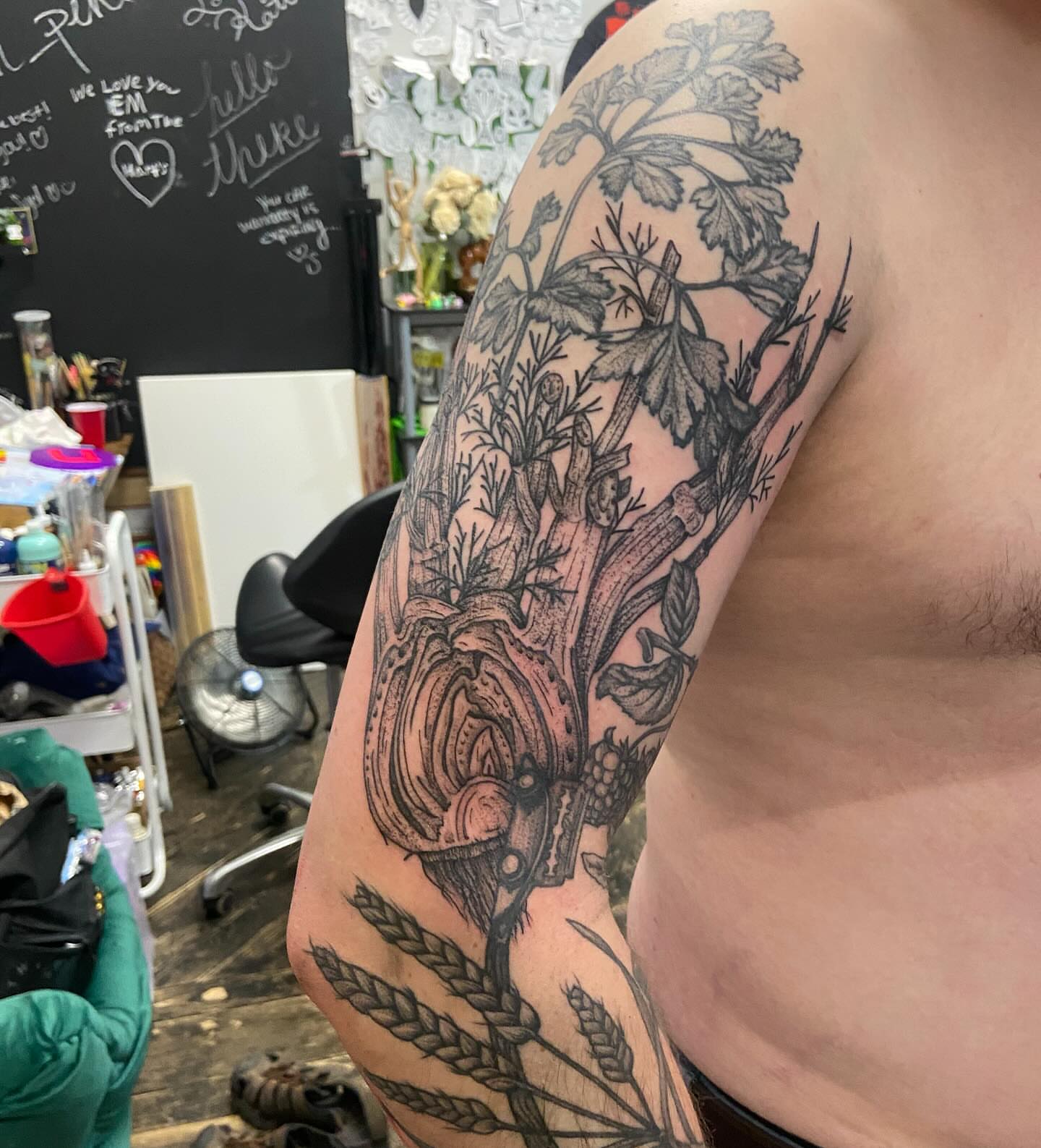 Botanical and mechanical elements realism tattoo on the upper arm by Dont Worry About It