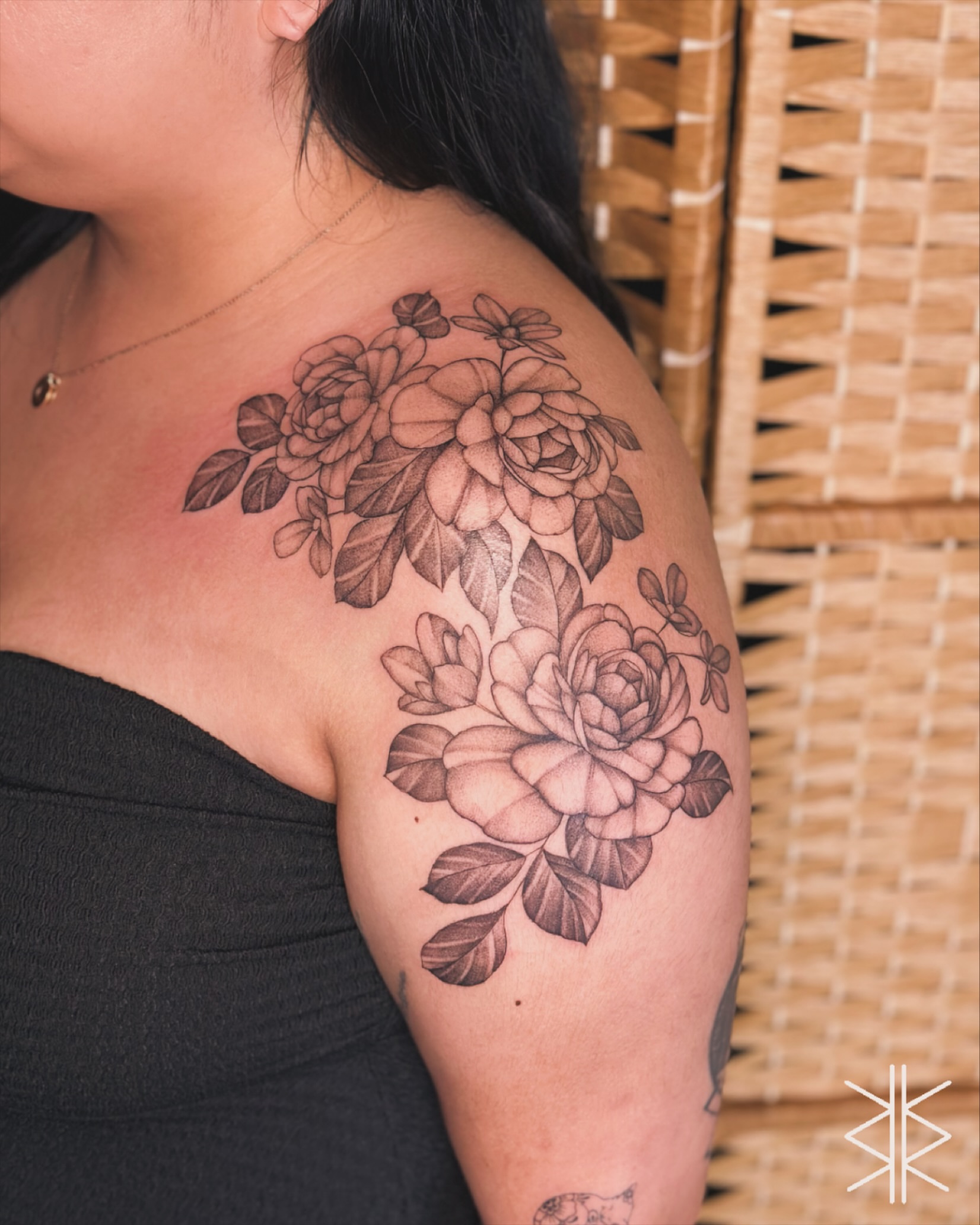 Floral bouquet black and grey tattoo on the shoulder by Eddie