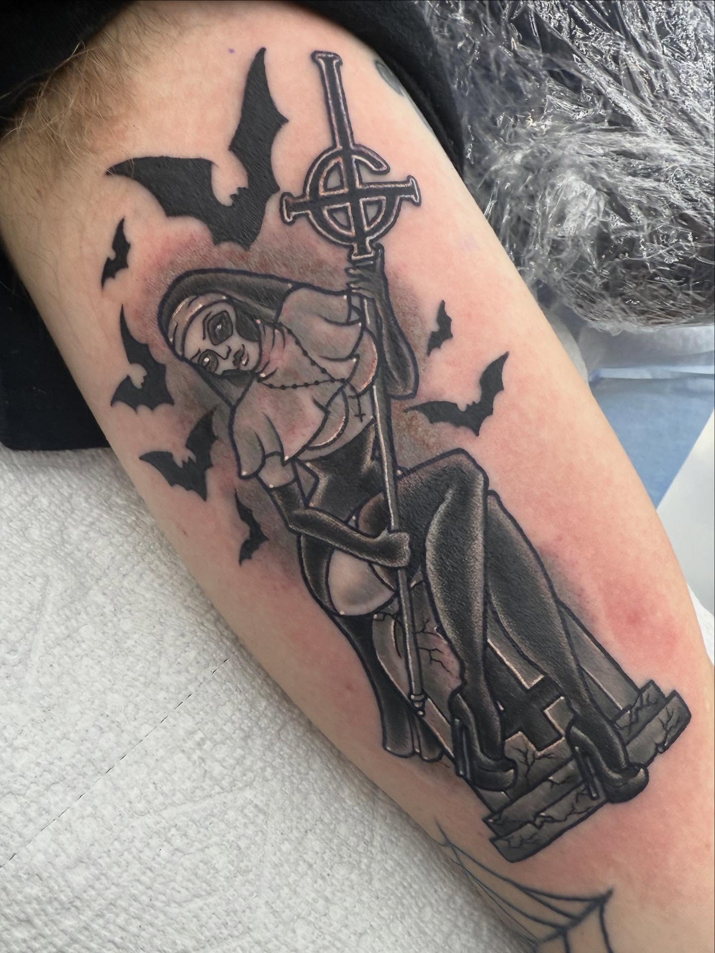 Woman with staff dark realism tattoo on the forearm by Autumn Fulford