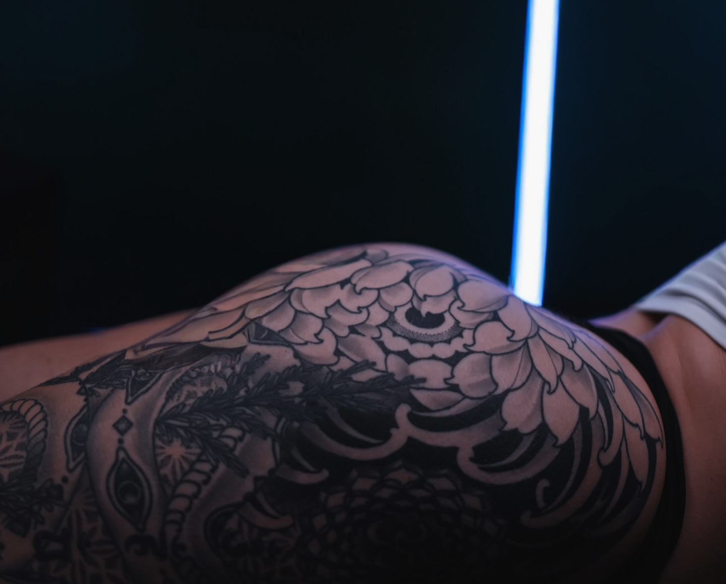 Floral design black and grey tattoo on the thigh by Ryan Spencer - San Diego Tattoo Artist