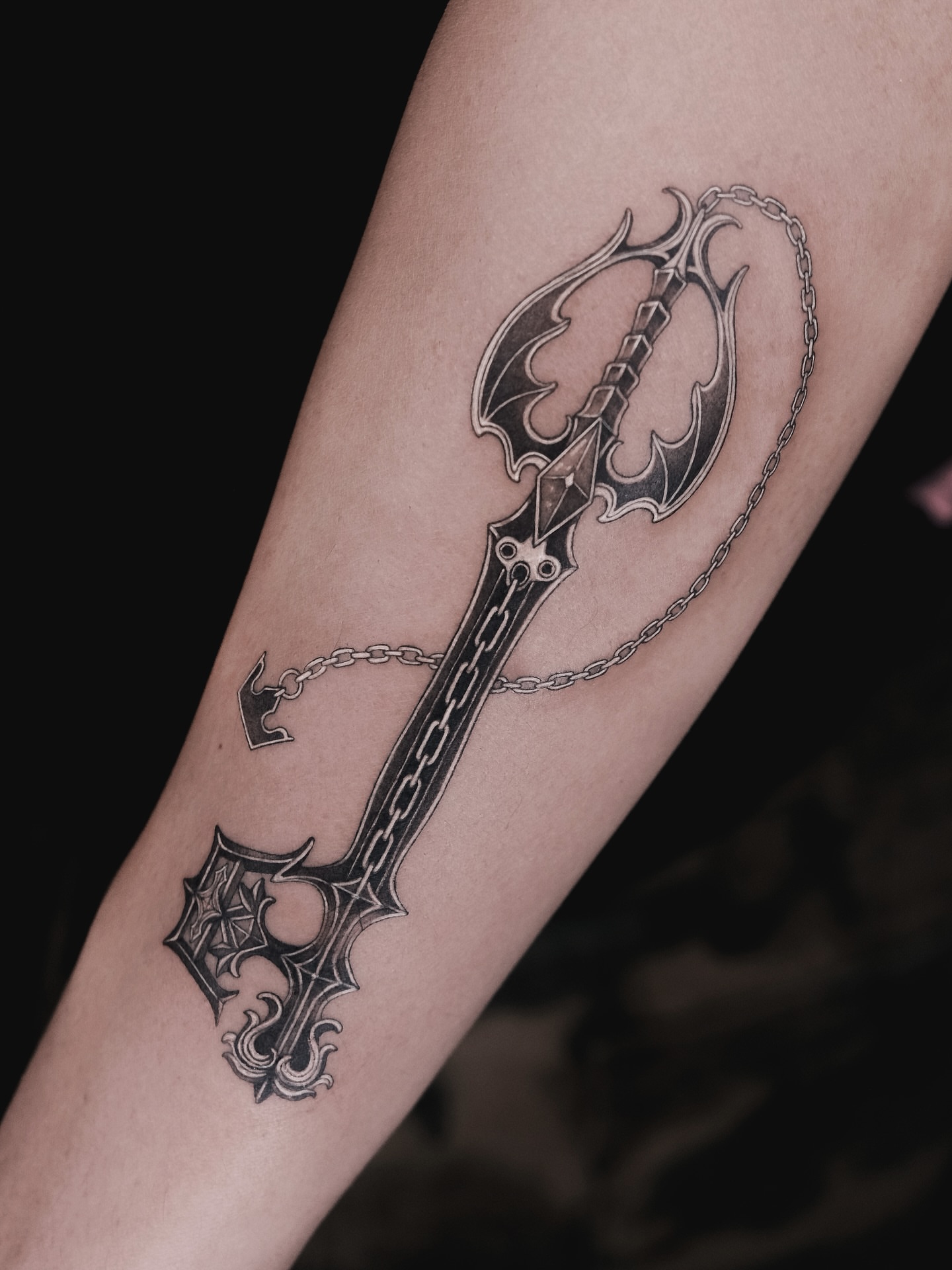 Key black and grey tattoo on the forearm by p o b i