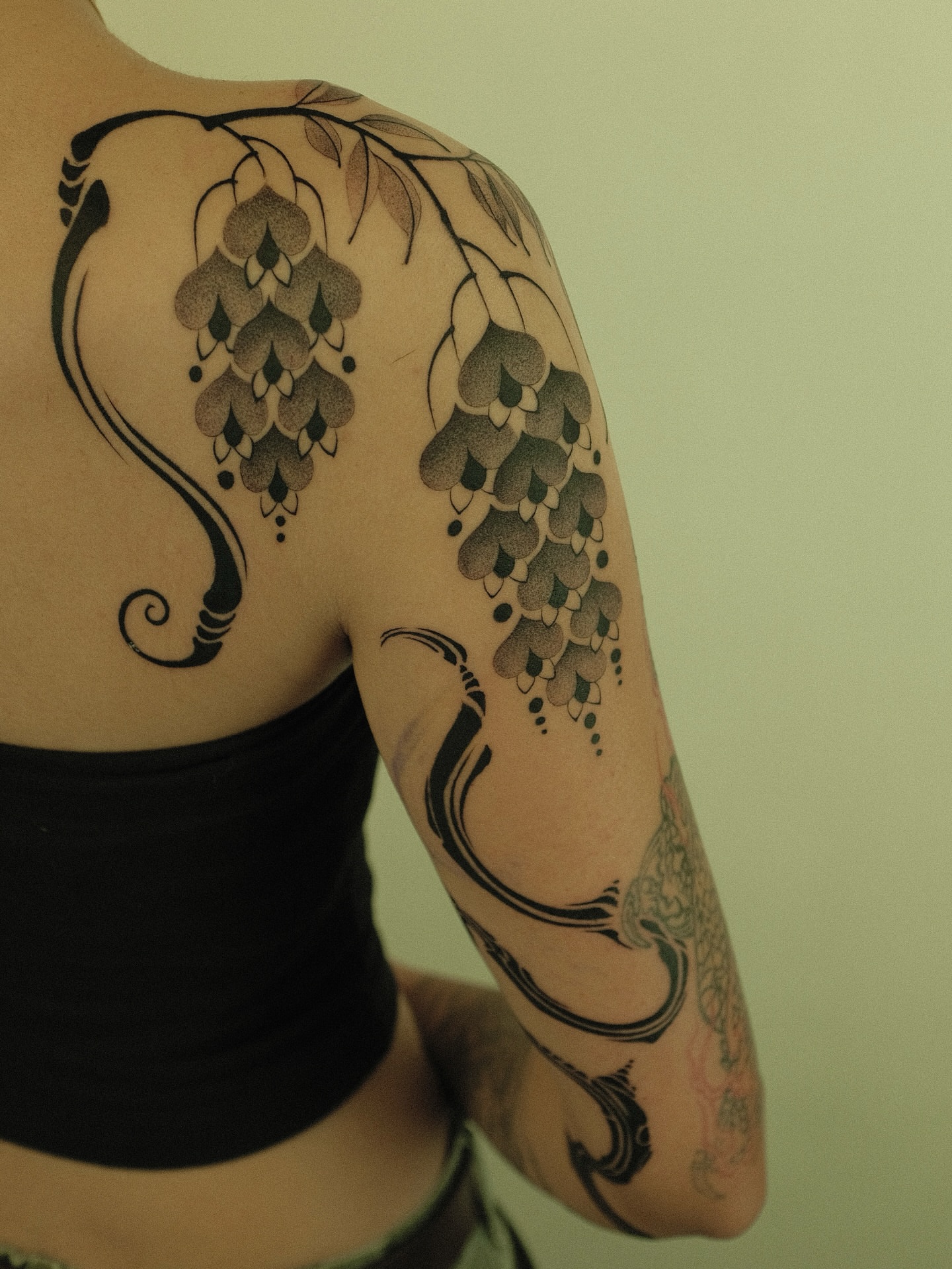 Wisteria black and grey tattoo on the shoulder by Xiao Lun
