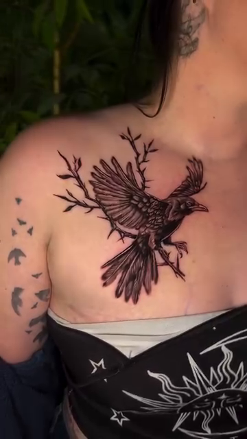 Raven on a branch realism tattoo by Romi Utah Tattoo