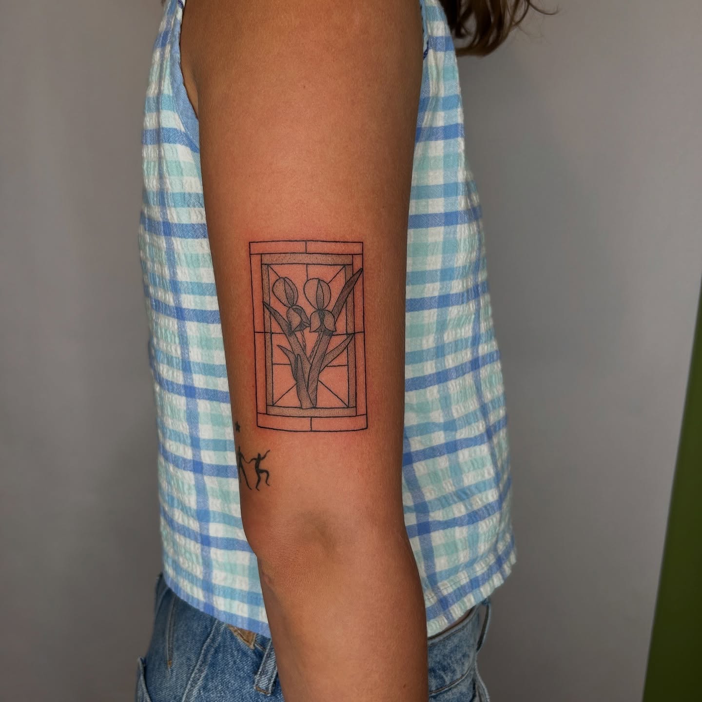 Stained glass window geometric tattoo on the forearm by beth