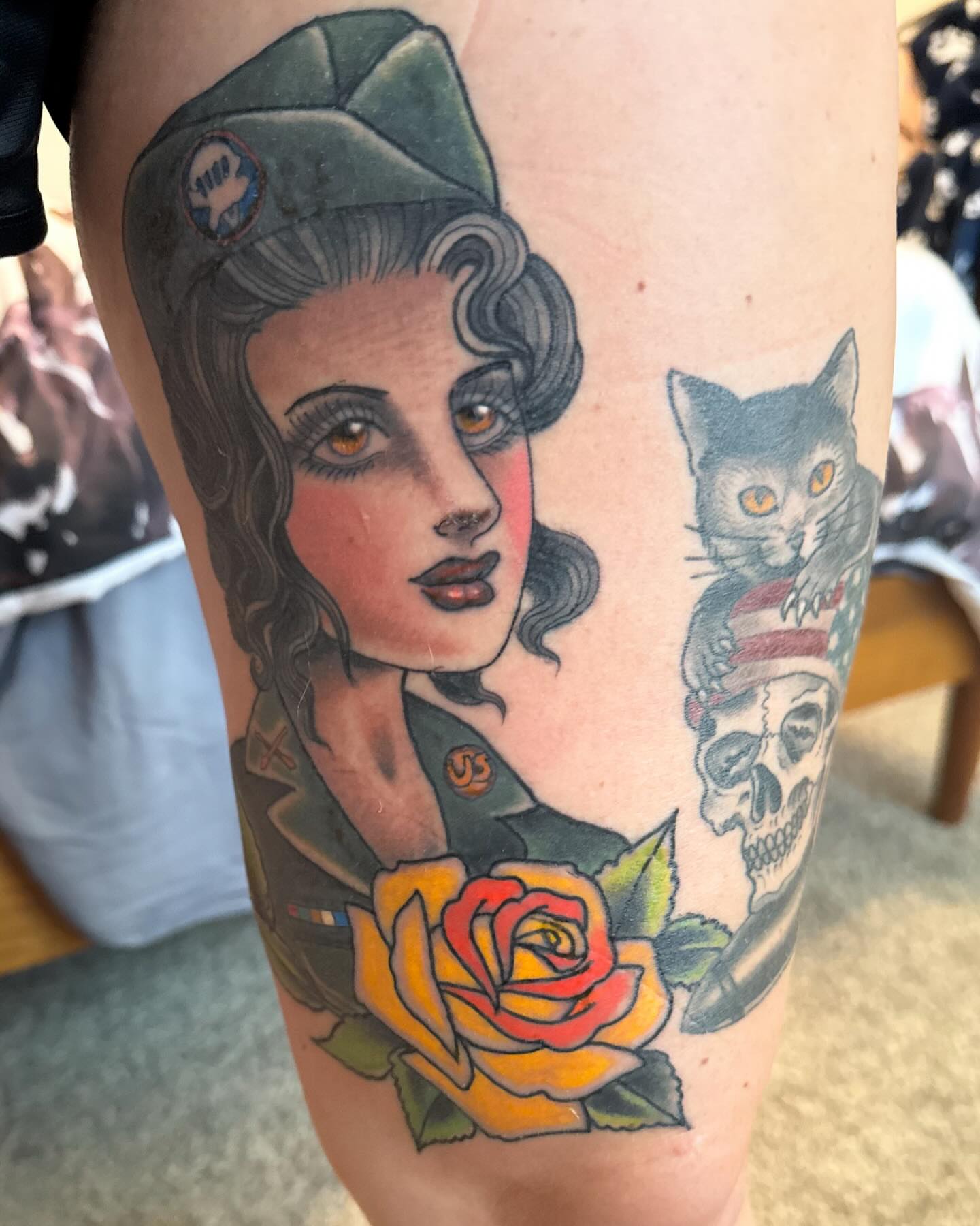 Woman with cat and skull American traditional tattoo on the forearm by Hayden Abernathy