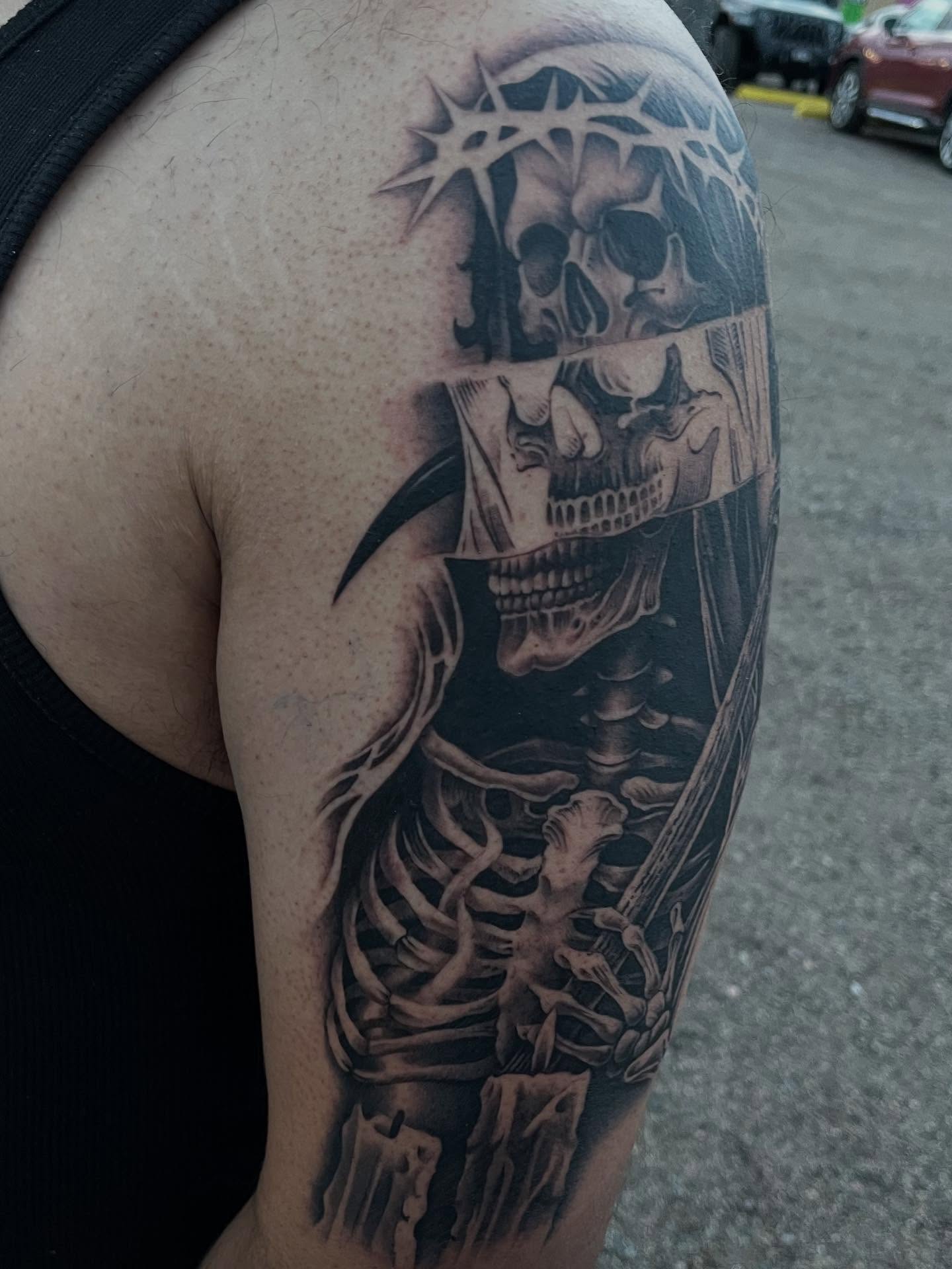 Skeleton with crown of thorns realism tattoo on the shoulder by Denver Tattoo Artist