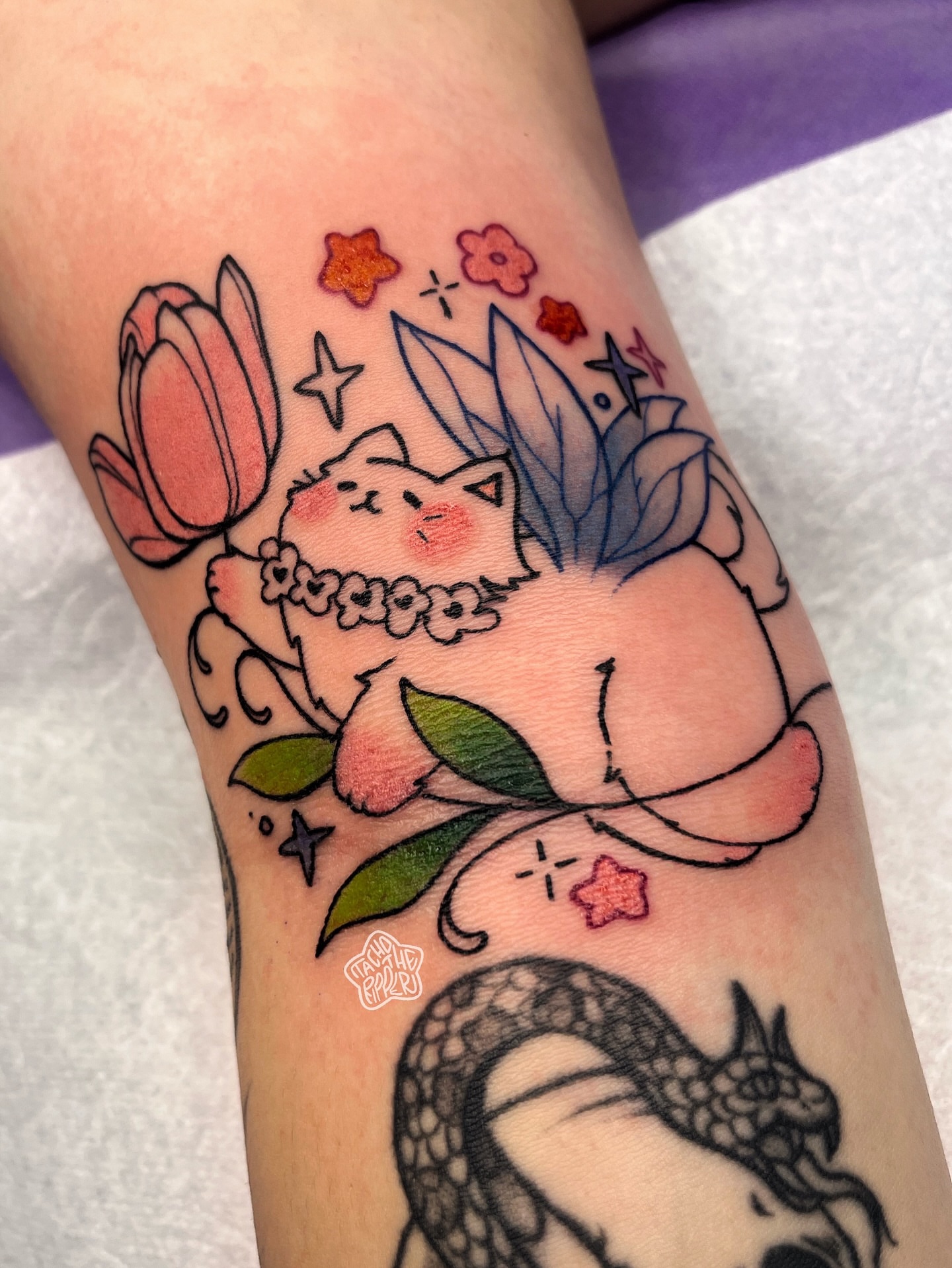 Cat with flowers watercolor tattoo on the forearm by tacho ☻ 張玉玲