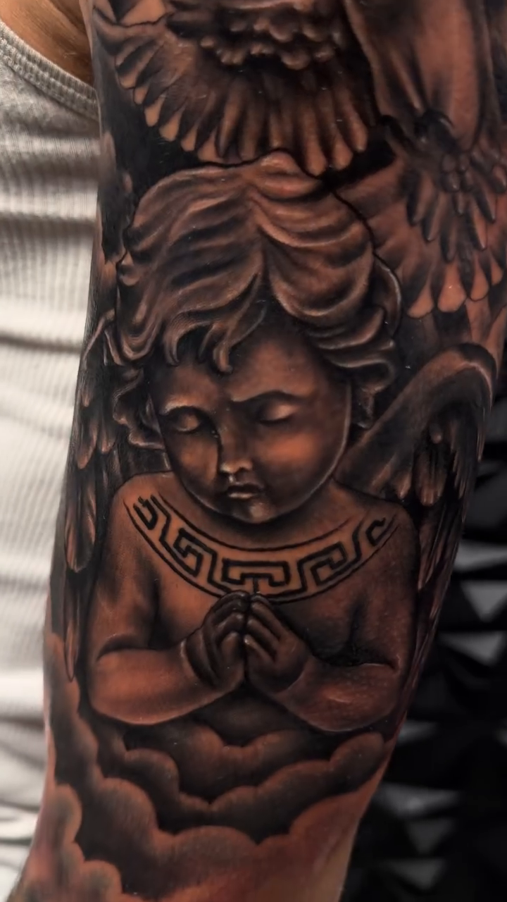Tattoo by @ink_m4gic12 — realism, black_and_grey