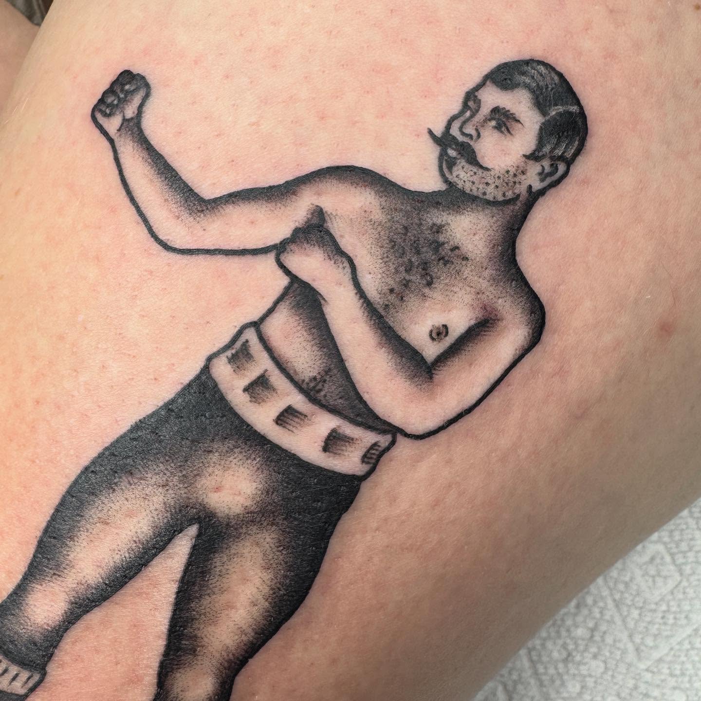 Man in boxing stance black and grey tattoo on the upper arm by 𝕷𝖊𝖝𝖎 𝕽𝖚𝖓𝖞𝖔𝖓