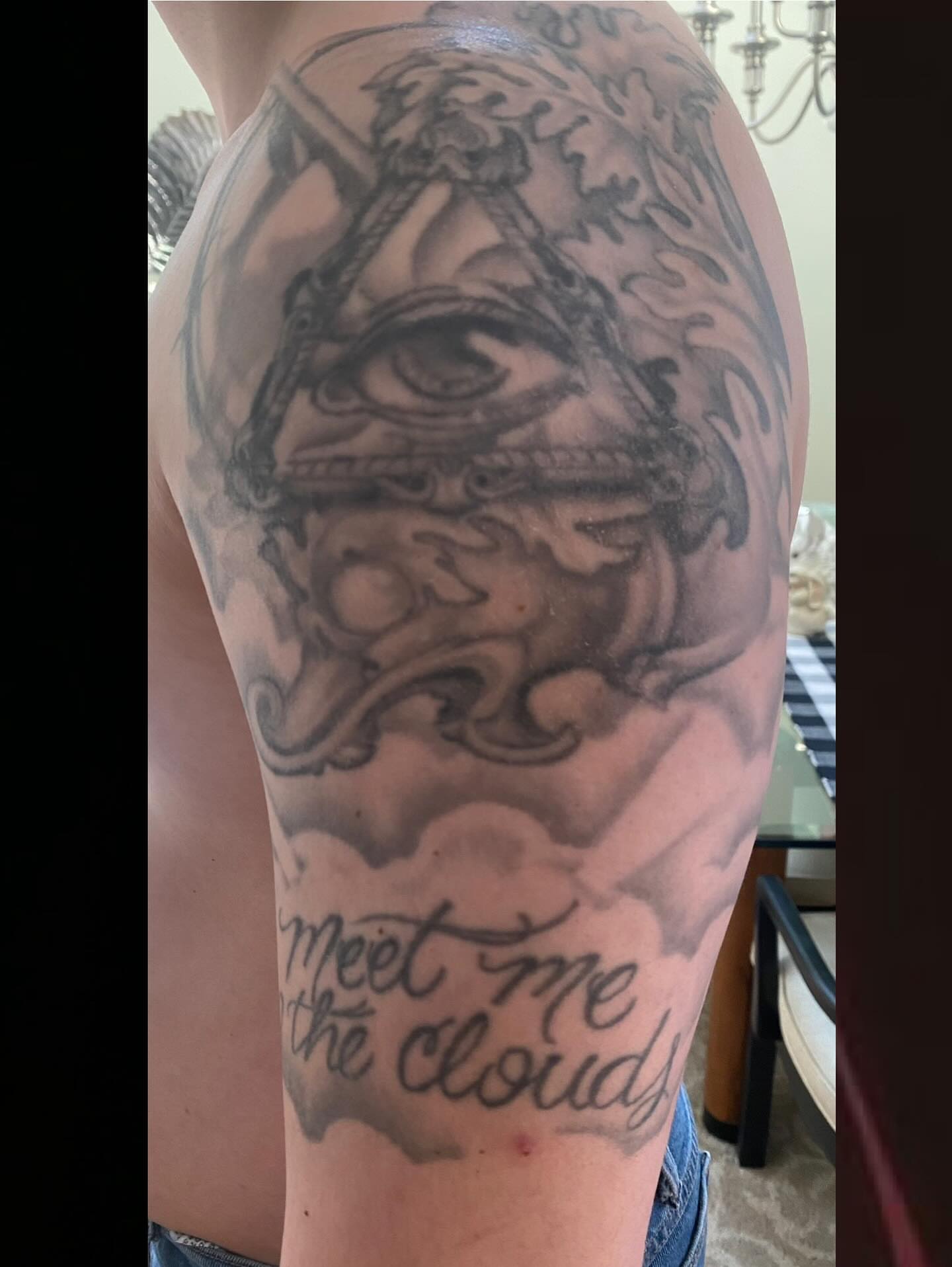 Eye and clouds realism tattoo on the forearm by Zoe "Z" Fisk