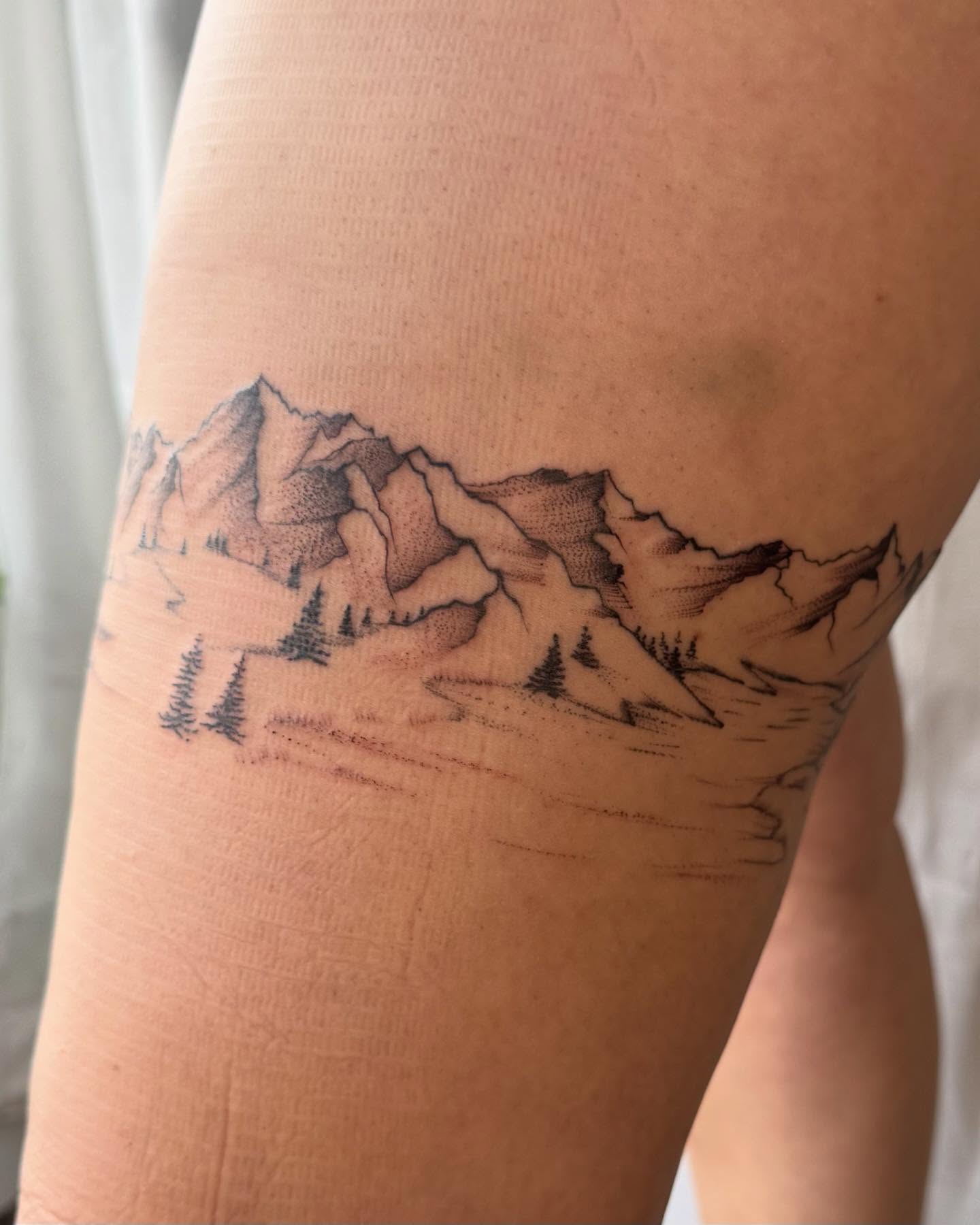 Mountain range black and grey tattoo on the thigh by RyAnn Lynn