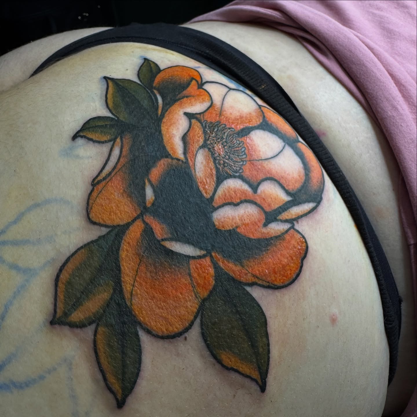 Orange rose American traditional tattoo on the thigh by Saffron Florea, Tiffin, Ohio